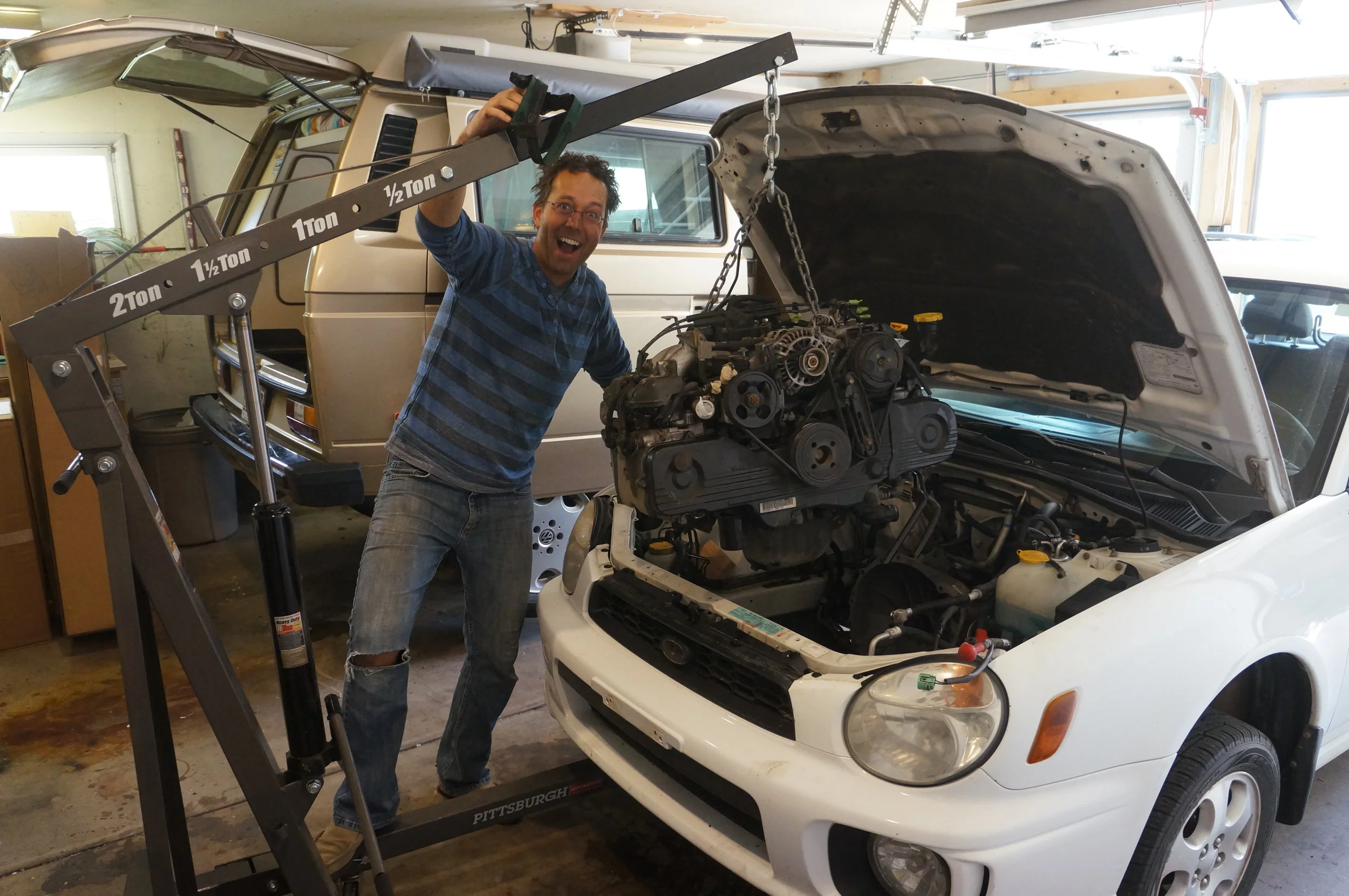 April 2017 - Chip, a.k.a. "The Mad Scientist," pulling out the Impreza engine so Spud can soon keep up with other cars on the road. Don't let him anywhere near your Subaru. Note the headlamp-induced hair style which is vaguely reminiscent of the sweet bowl-cut he sported in high school. Try not to be jealous.