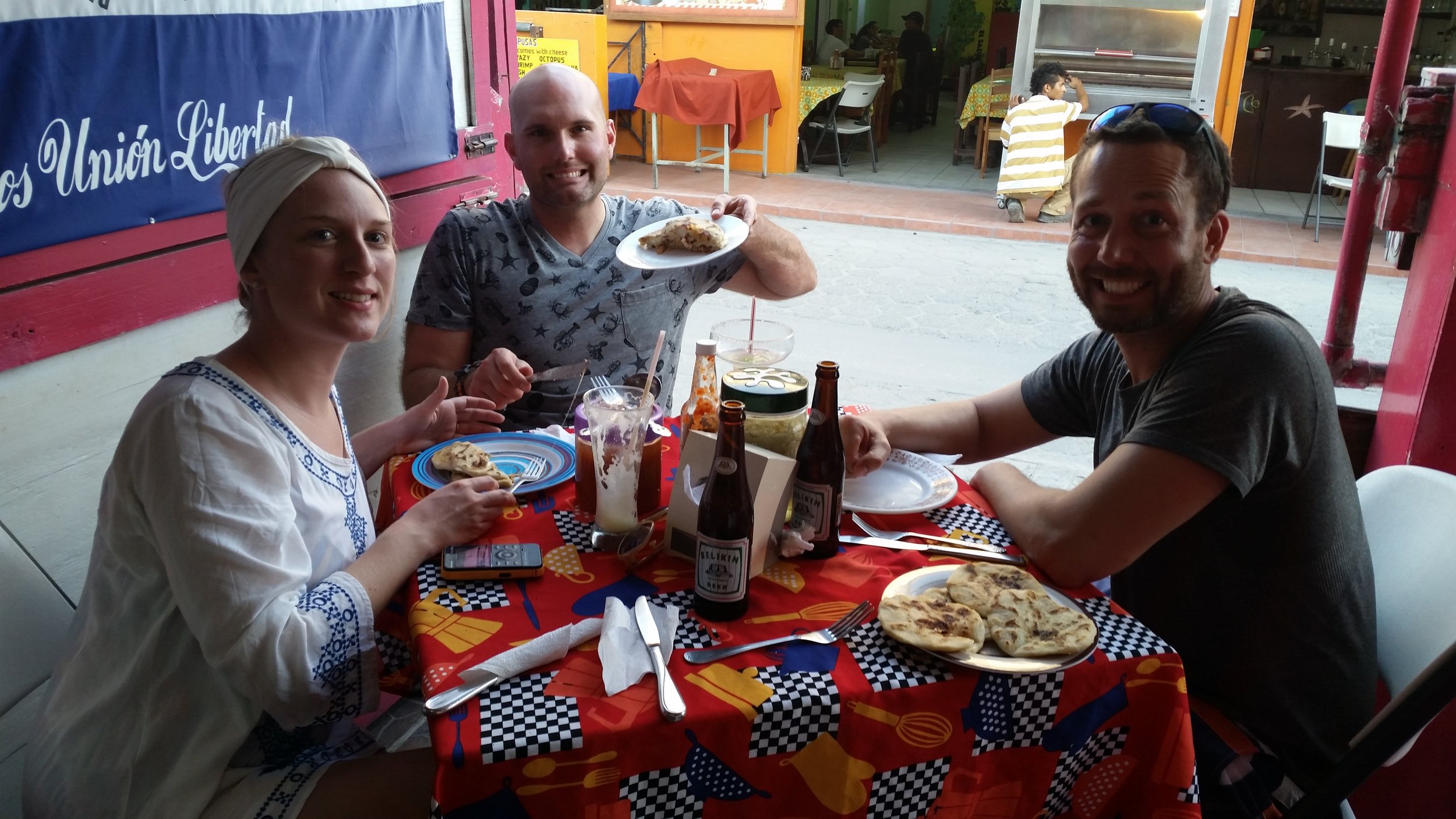 Pupusas and Beliken beer = Four happy tourists