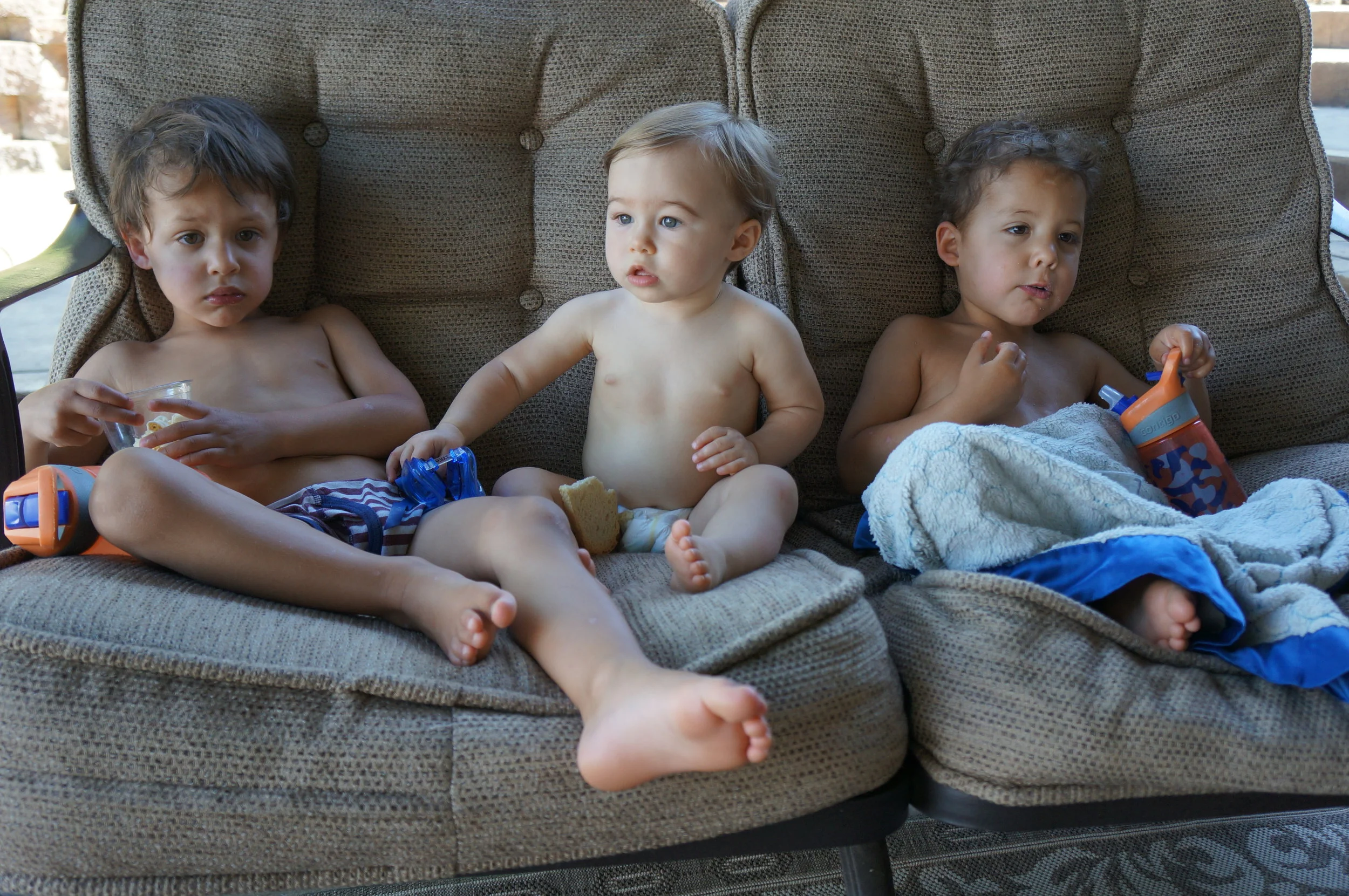 It's serious business during after-nap snacktime - Bennett, Penelope, and Reid. 