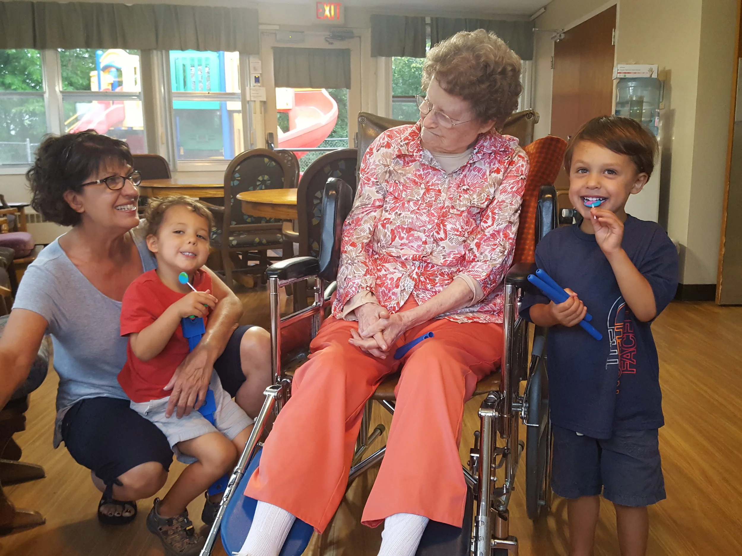 Visiting granny at the Rushford Nursing Home - Mimi, Reid, Granny, and Bennett.