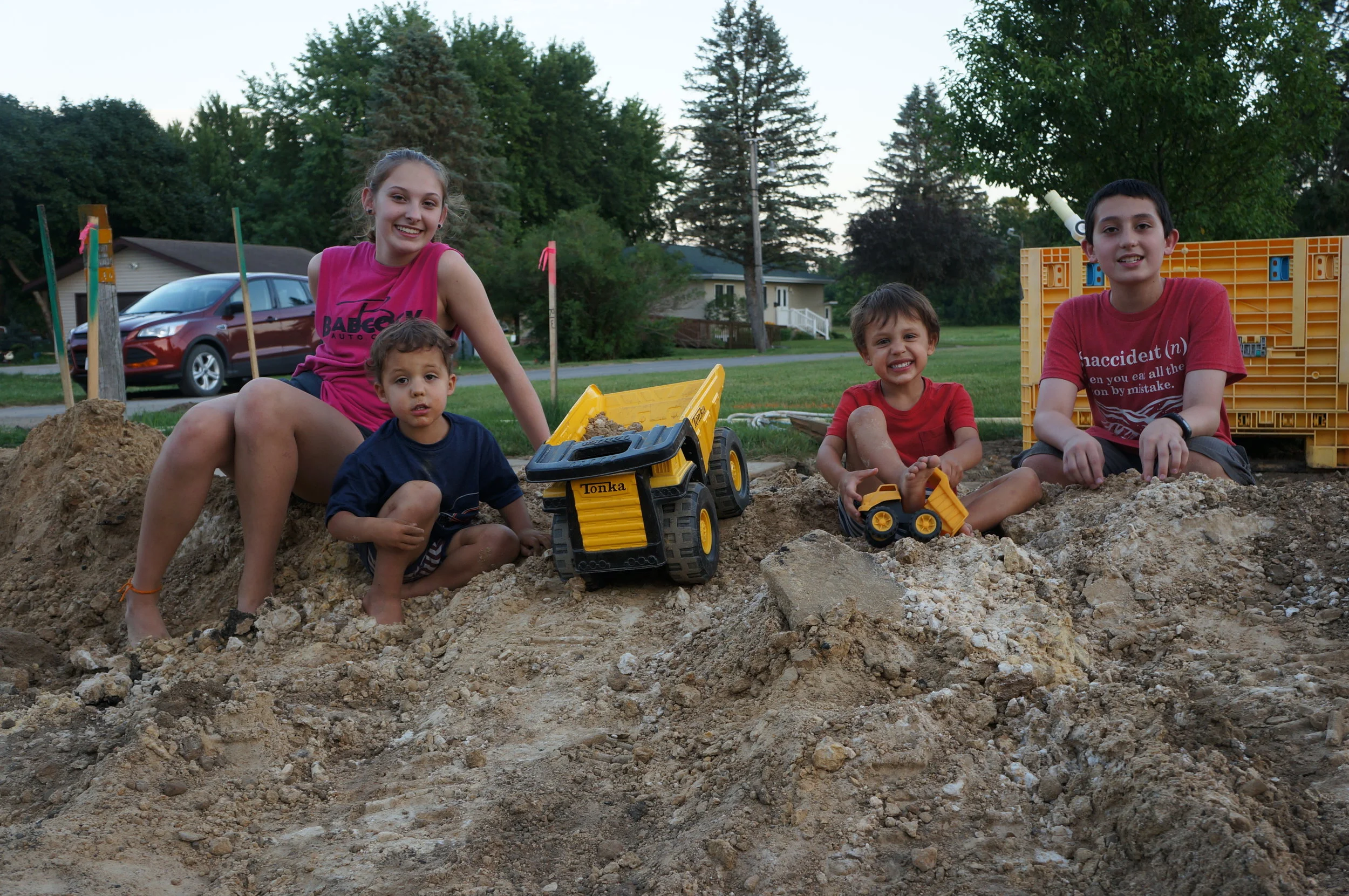 Playing in the dirt with the Himlie cousins - Alexa and Ryan.
