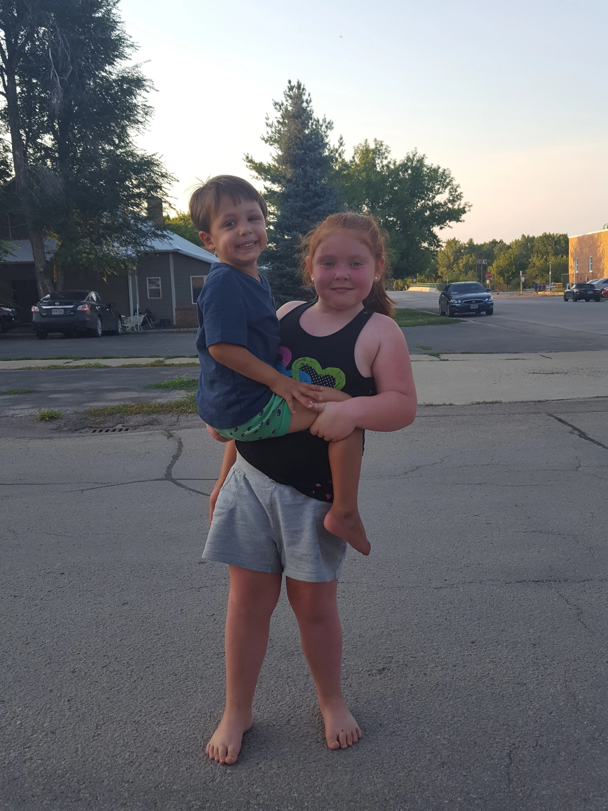 Lanie taking the boys back and forth to the trampoline. She wins the award for youngest person we'd trust to take the boys somewhere alone.