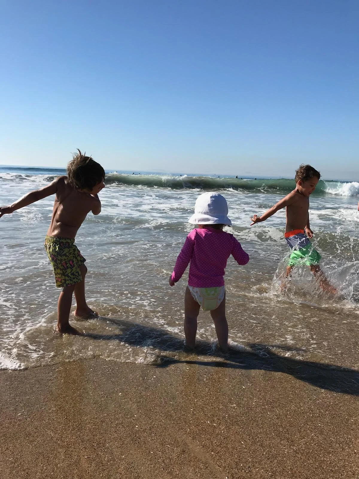 Showing Penelope how to splash like a pro.