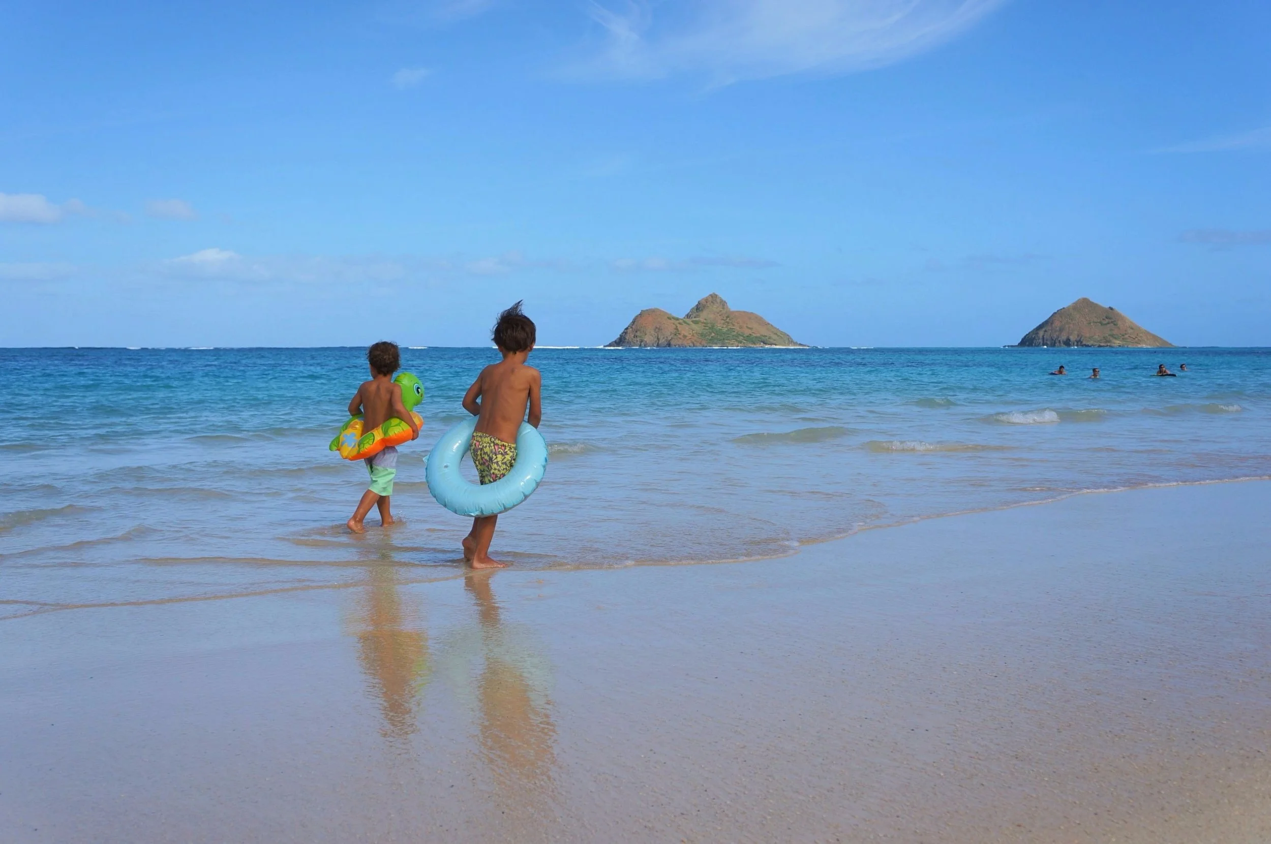 The boys preparing for a swim on Lanikai Beach.