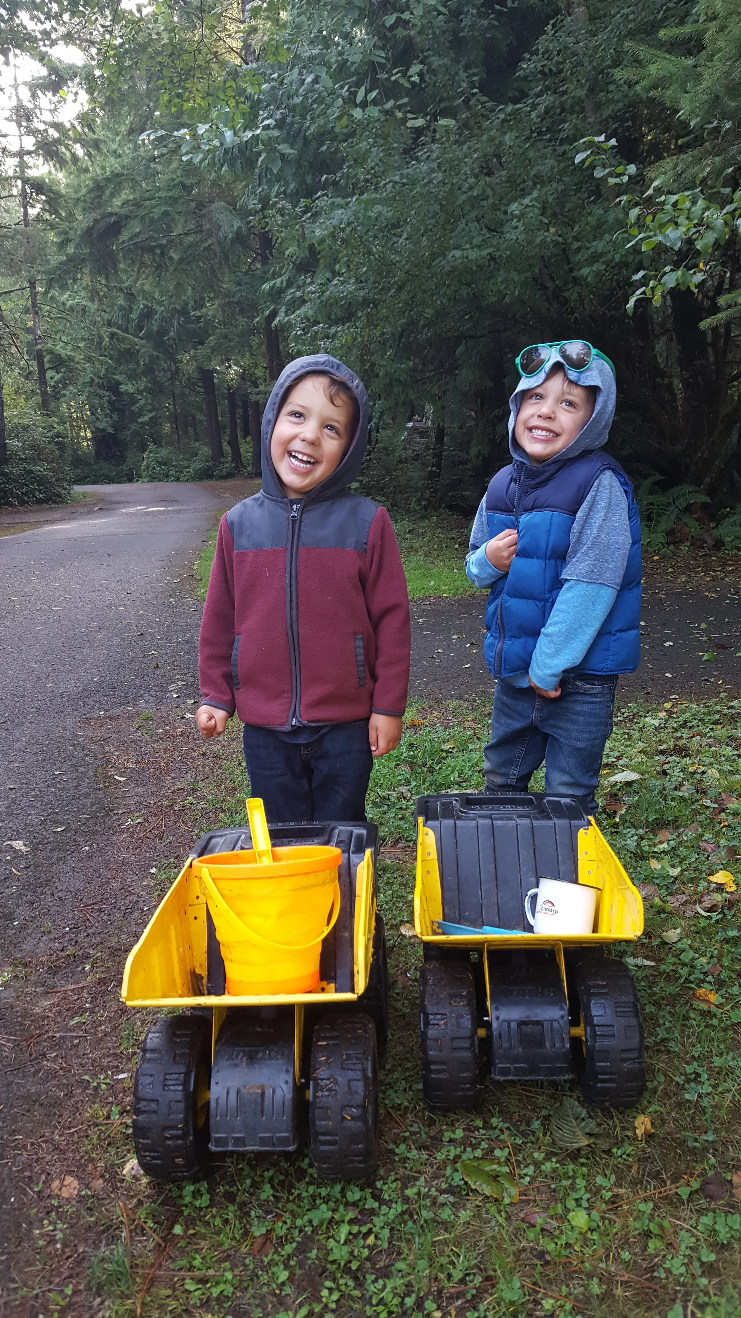 Heading from our campsite to the beach with their most prized possessions: two (partially) steel Tonka trucks