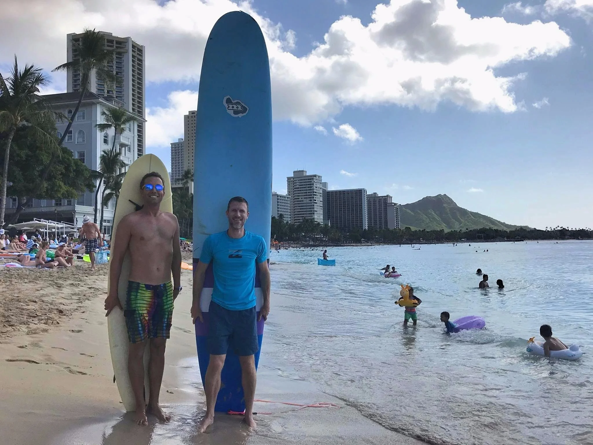 Chip & Brian heading out for a surf sesh on Waikiki Beach. Honey, did somebody shrink your surfboard?