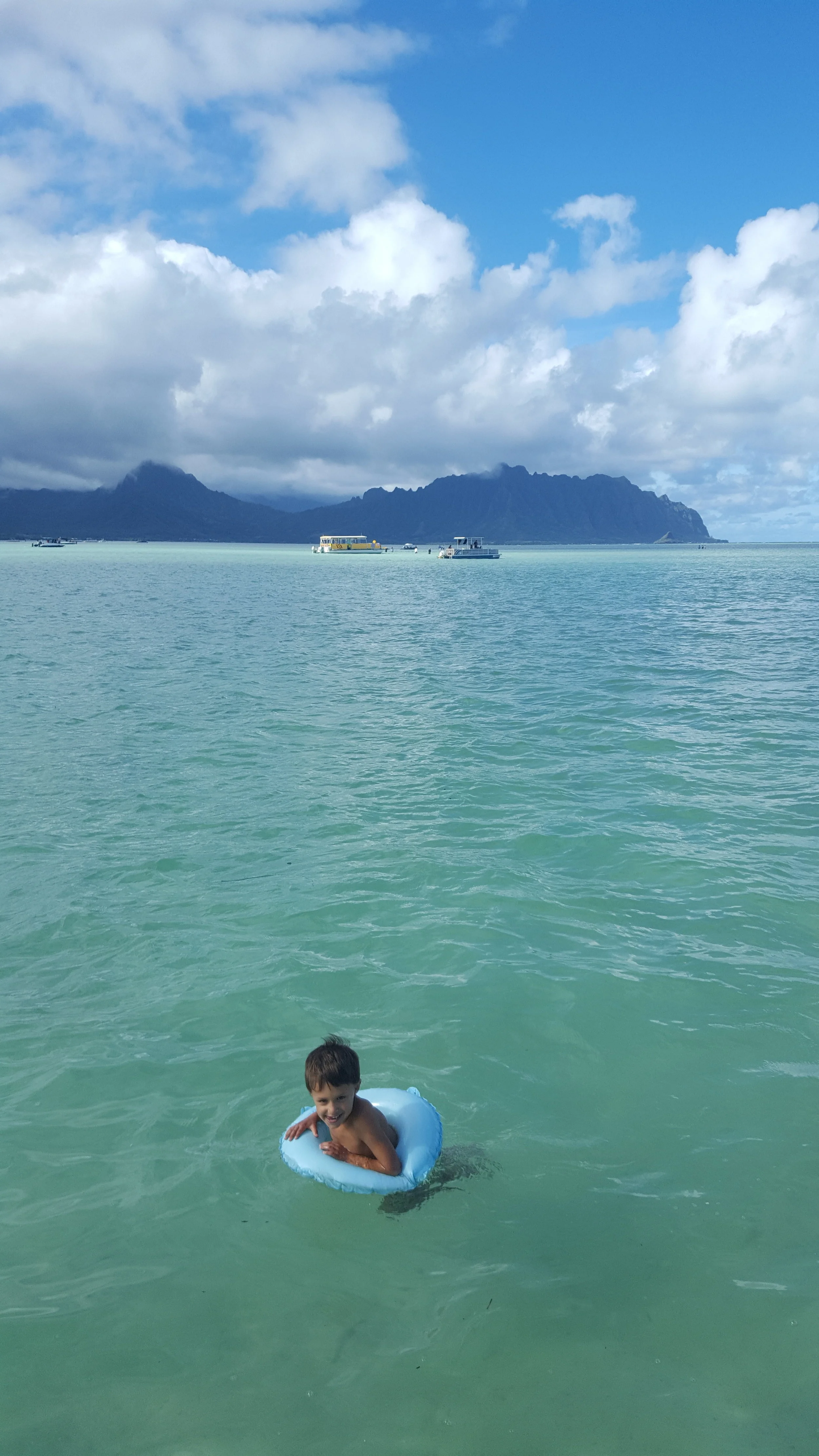 A boat ride in Kaneohe Bay with friends - Bennett taking a quick dip.