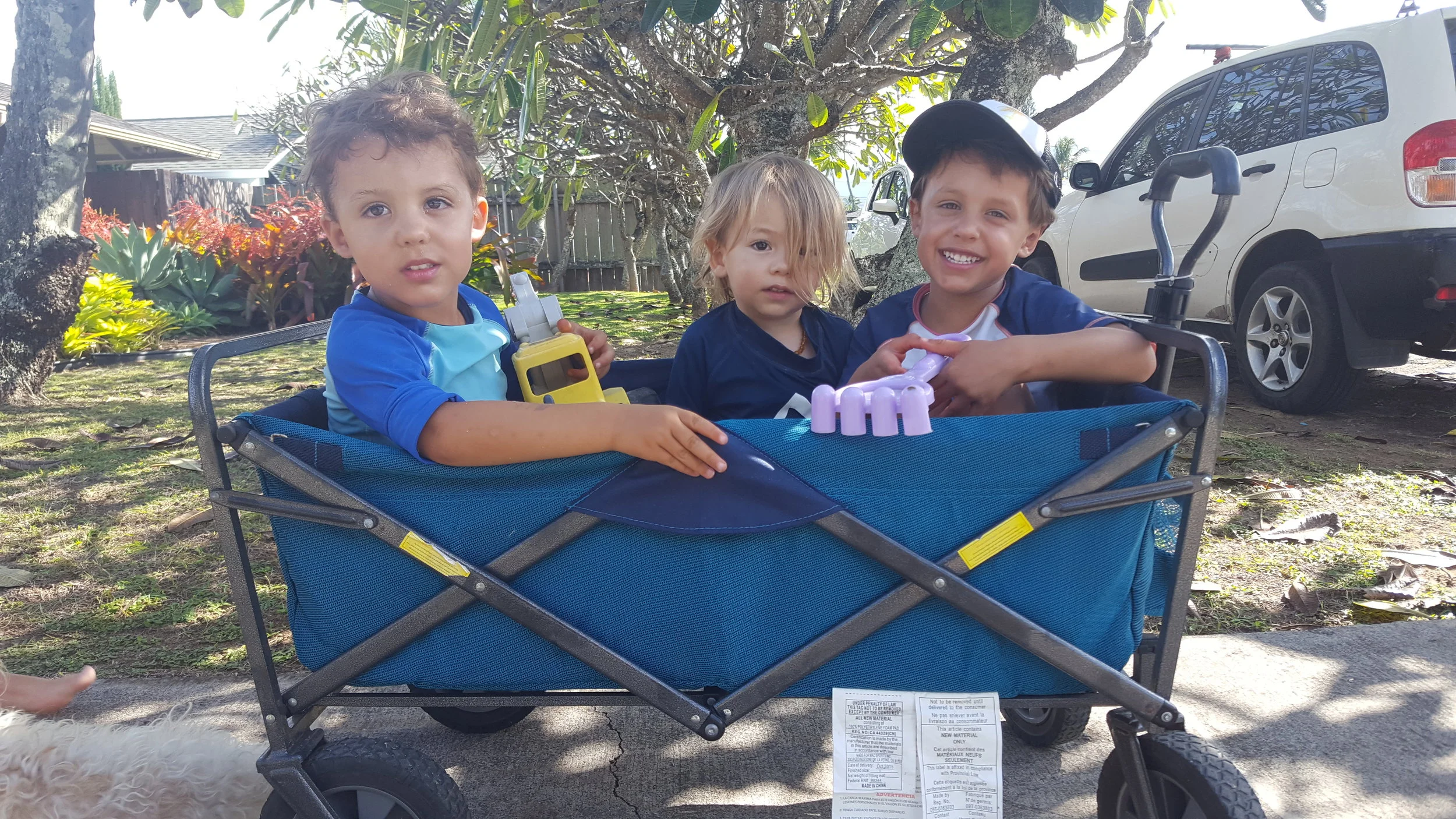 Heading out to the beach via wagon rides! Reid, Elijah, and Bennett. 