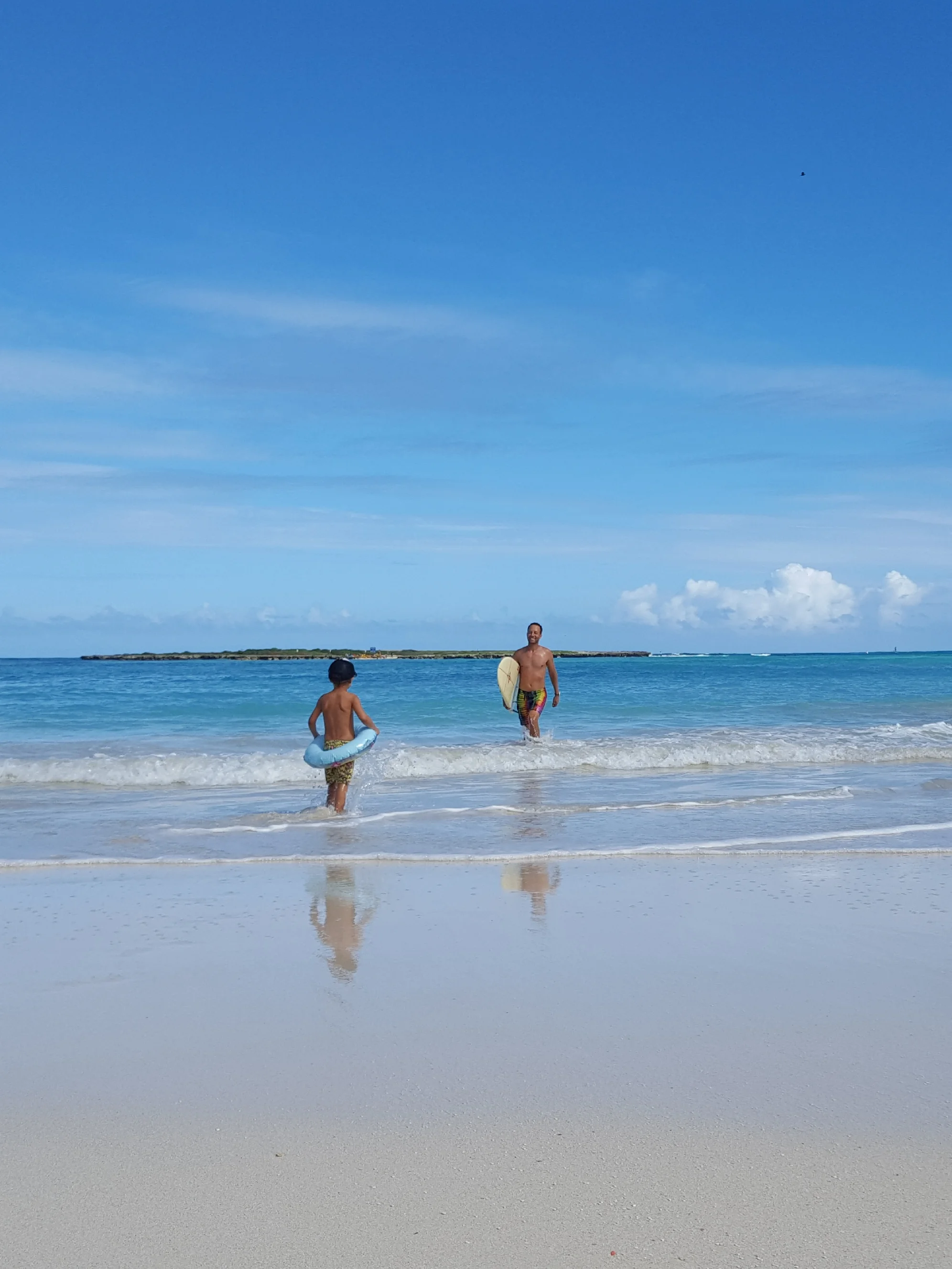 Cheering dad in from a surfing sesh.