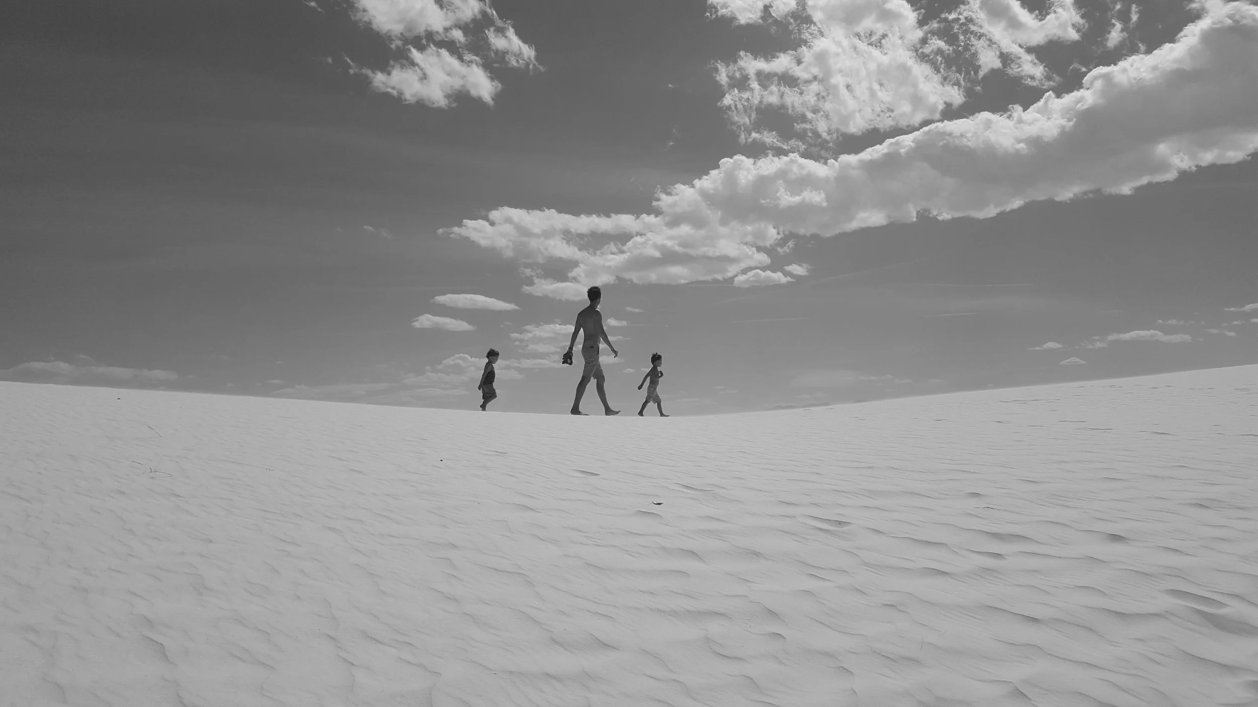 My boys summiting a dune at White Sand Dunes National Monument.
