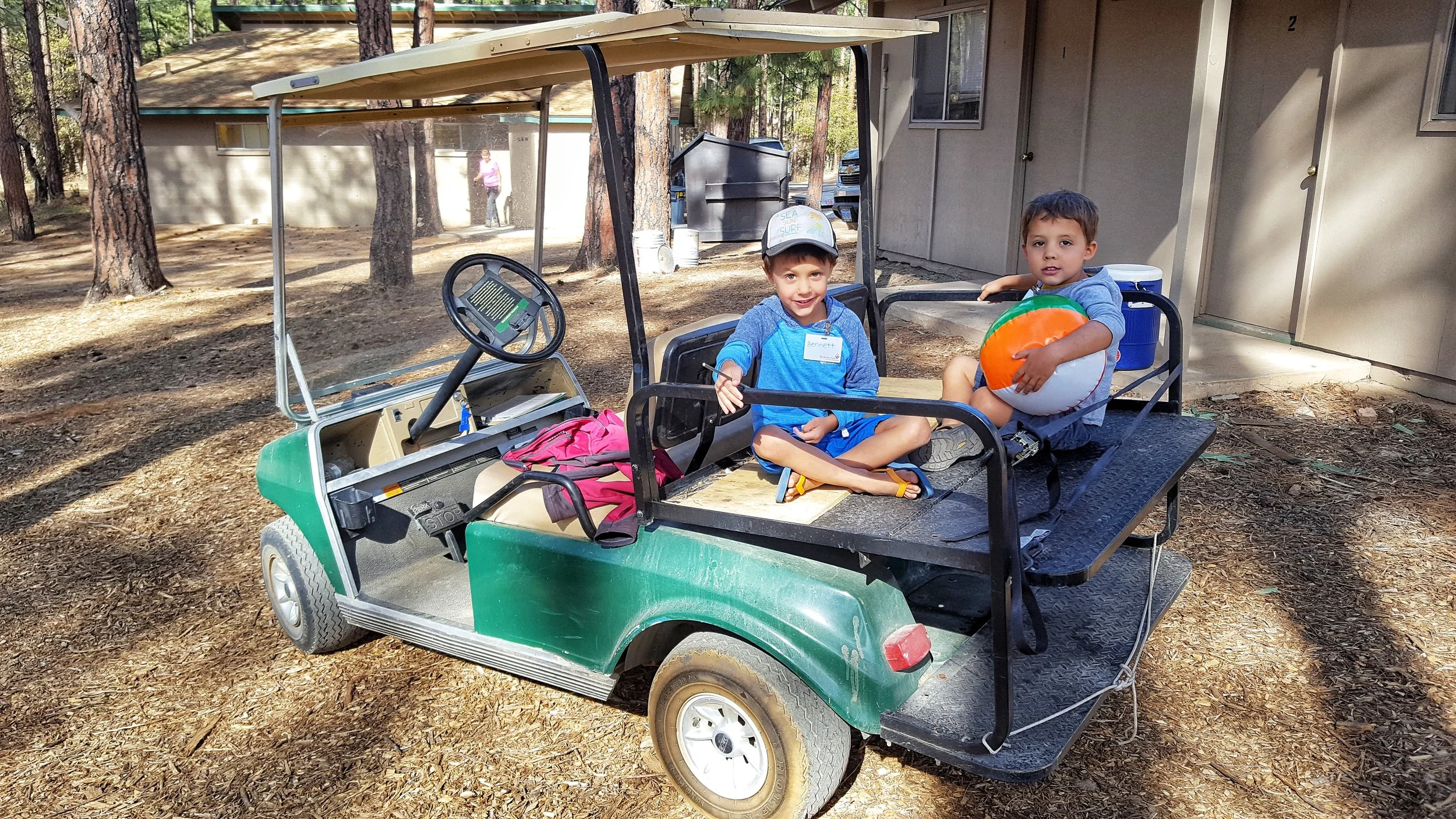 The boys out for a water delivery run with Carolyn.