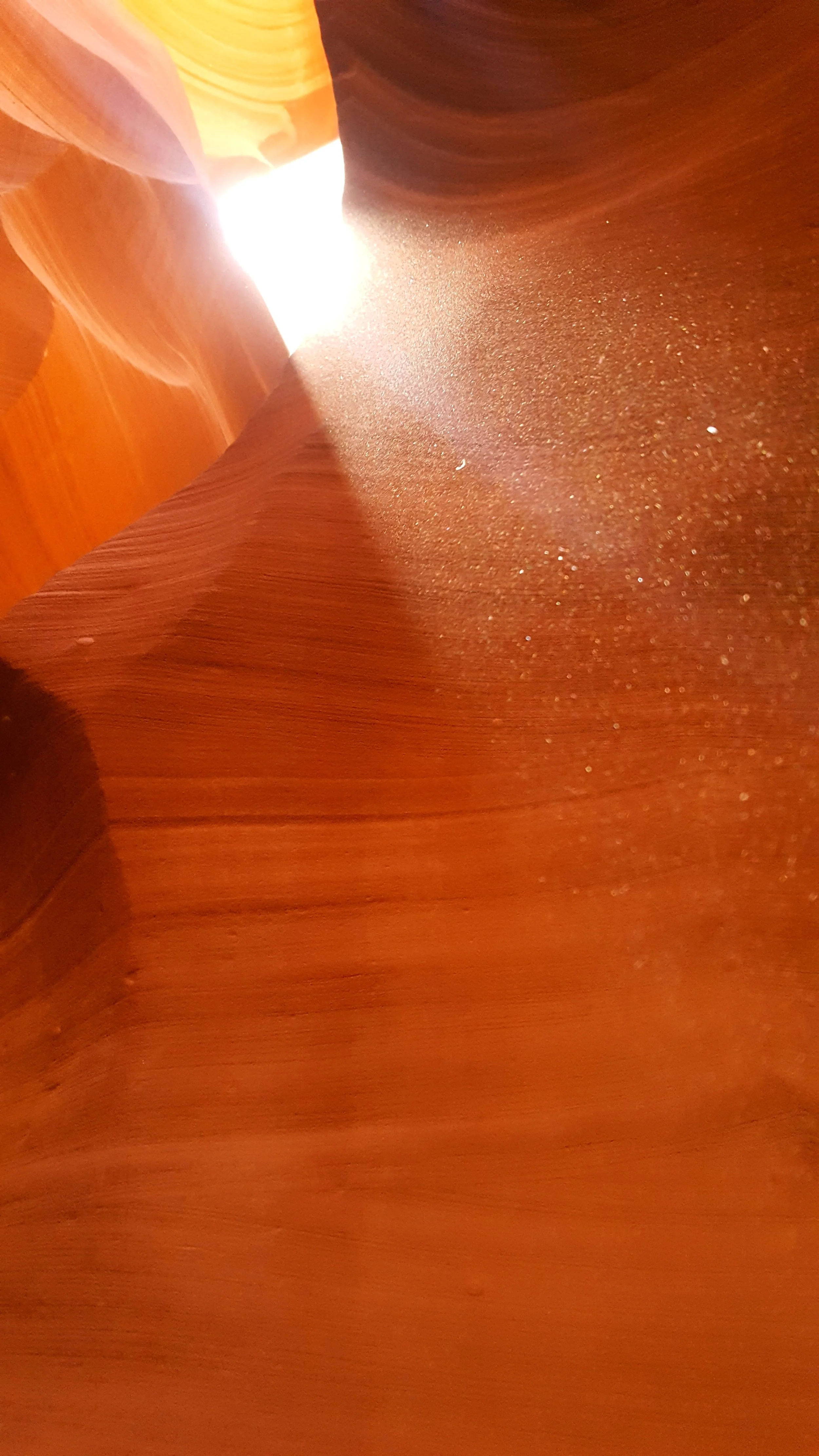 The boys happily threw sand in the air to show the ray of light.