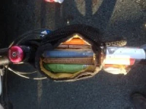 “Nose bag’ filled with energy bars attached to top tube on bike frame