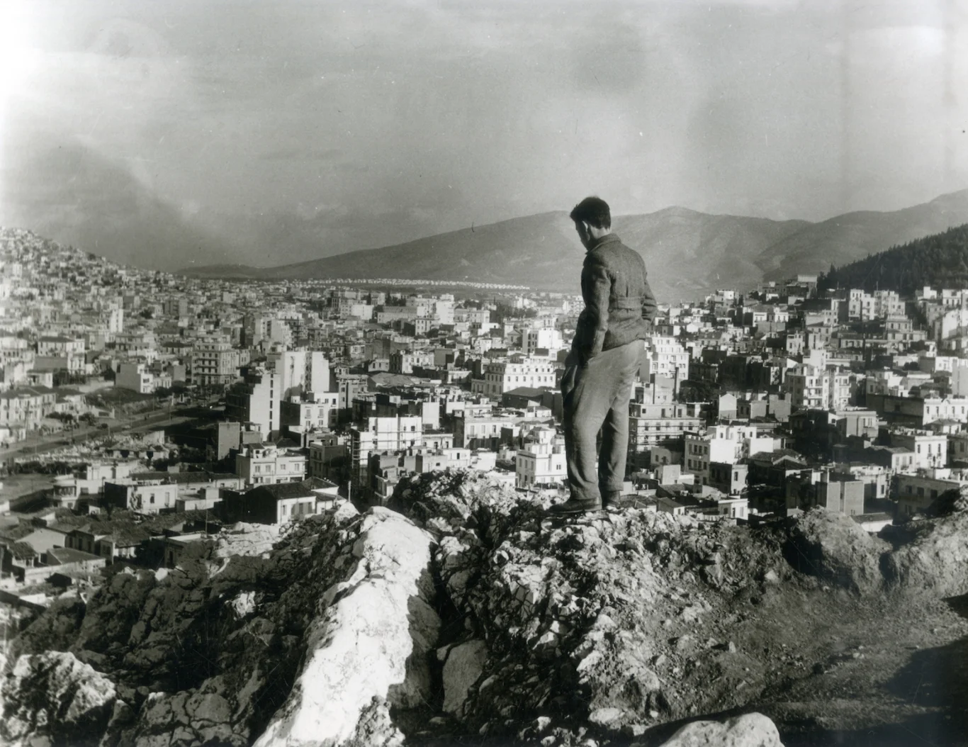 Man contemplating the expansion of the twentieth-century city, Athens, 1957. © Benaki Museum, Costas Megalokonomou Archives