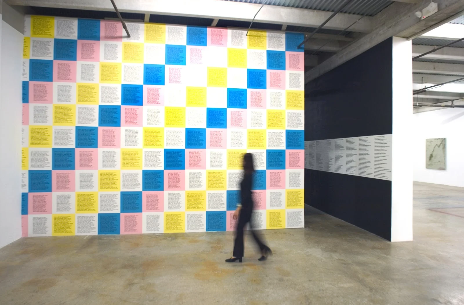 The Jenny Holzer solo-show at the Rubell Family Collection in Miami (2003) curated by Diaz. Pictured, Holzer’s Inflammatory Essays as multi-colored wallpaper at the exhibition entrance. Courtesy José Carlos Diaz.