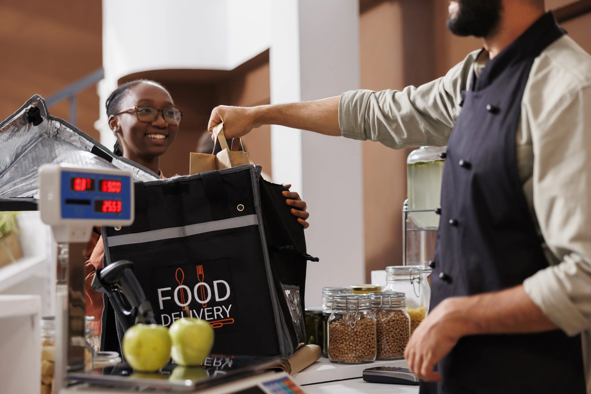 Delivery_Woman_Receiving_Groceries_original_2063225.jpg