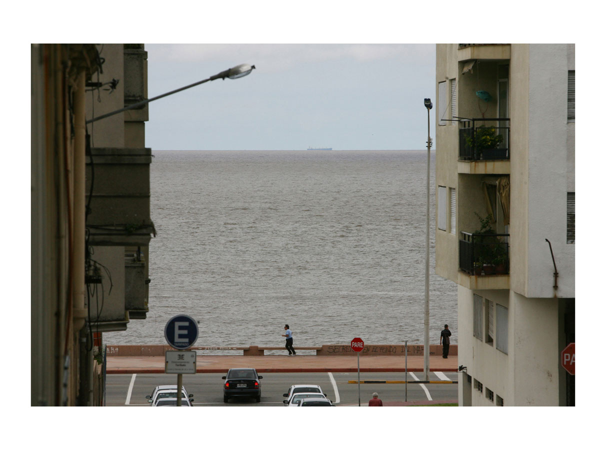   High Tide  (Montevideo, Uruguay, 2010) by Johnny Green (33 x 43cm)   Size: 13 H x 16.9 W x 1.7 in   This is the 1st of 21 Limited Edition C-type Lambda prints, encased in a beautiful, black wooden frame. The matt photograph has an elegant off white