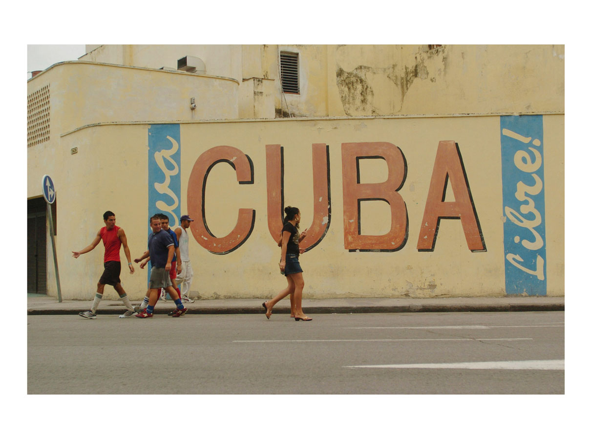   Viva Cuba Libre!  (Havana, Cuba, 2006) by Johnny Green (53 x 73cm)   Size: 20.9 H x 28.7 W x 1.7 in   This is the 1st of 12 Limited Edition C-type Lambda prints, encased in a beautiful, black wooden frame. The matt photograph has an elegant off whi