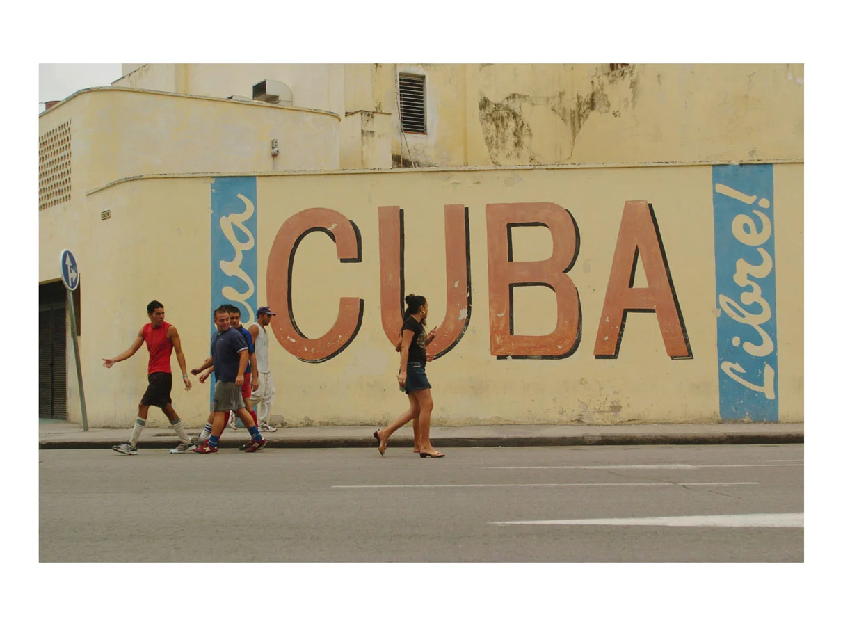 Viva Cuba Libre! (Havana, Cuba, 2006) by Johnny Green (53 x 73cm) Price: £450 Size: 20.9 H x 28.7 W x 1.7 in This is the 1st of 12 Limited Edition C-type Lambda prints, encased in a beautiful, black wooden frame. The matt photograph has an elegant off white mount which is signed and numbered by the artist.