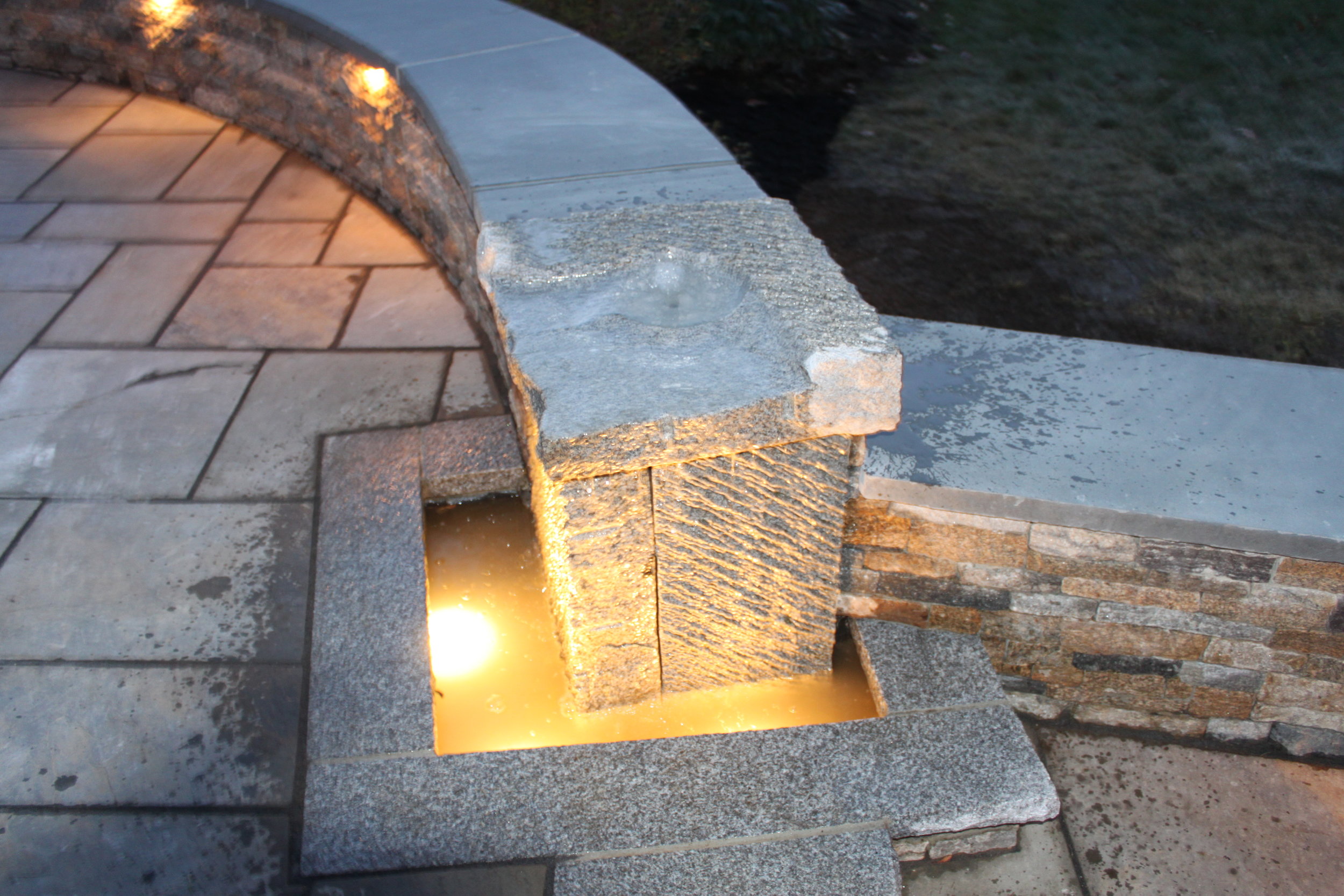 Top landscape design with stone veneer in Laconia, NH