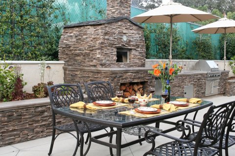 How to Enjoy Cooking in Your Outdoor Kitchen in All Weather Conditions in Waltham, MA