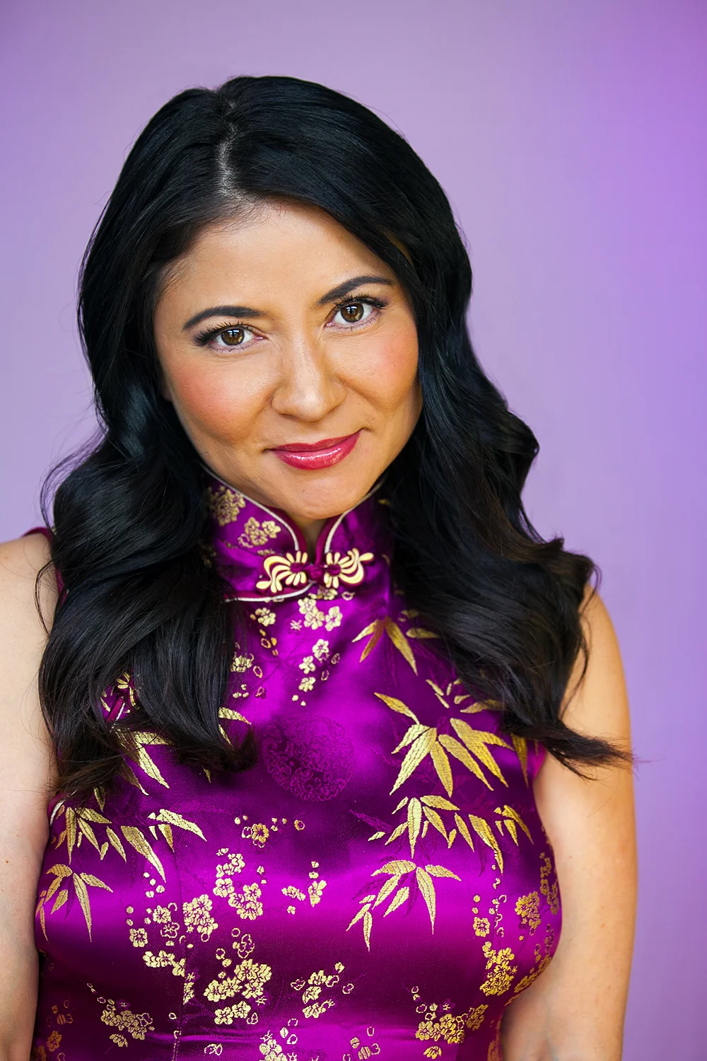 Studio headshot with a colorful background