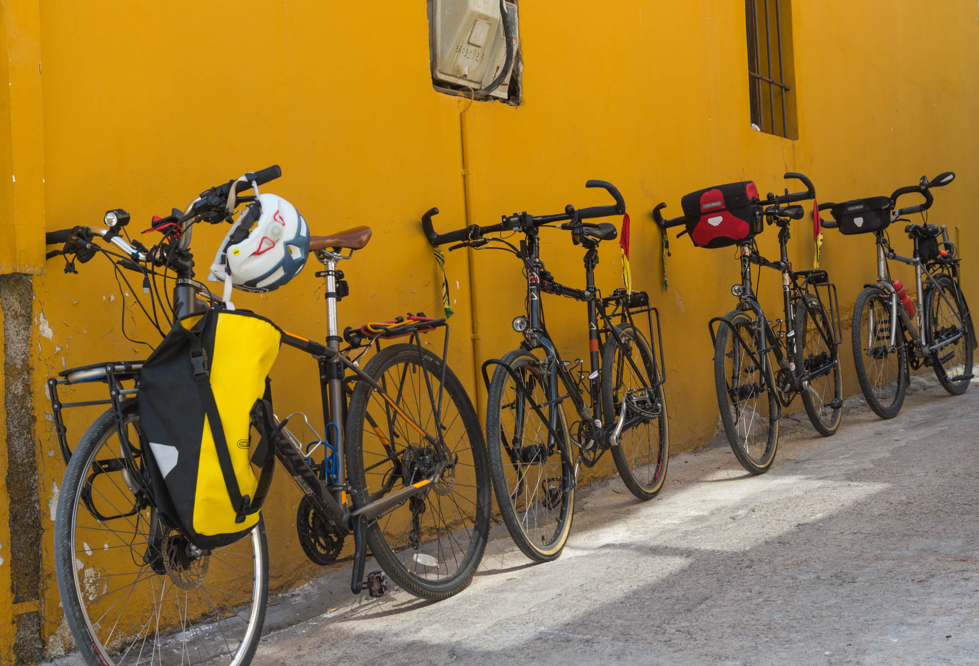 Four touring bikes - all outfitted with SteerStoppers® and parked on a downhill slope... no problem!