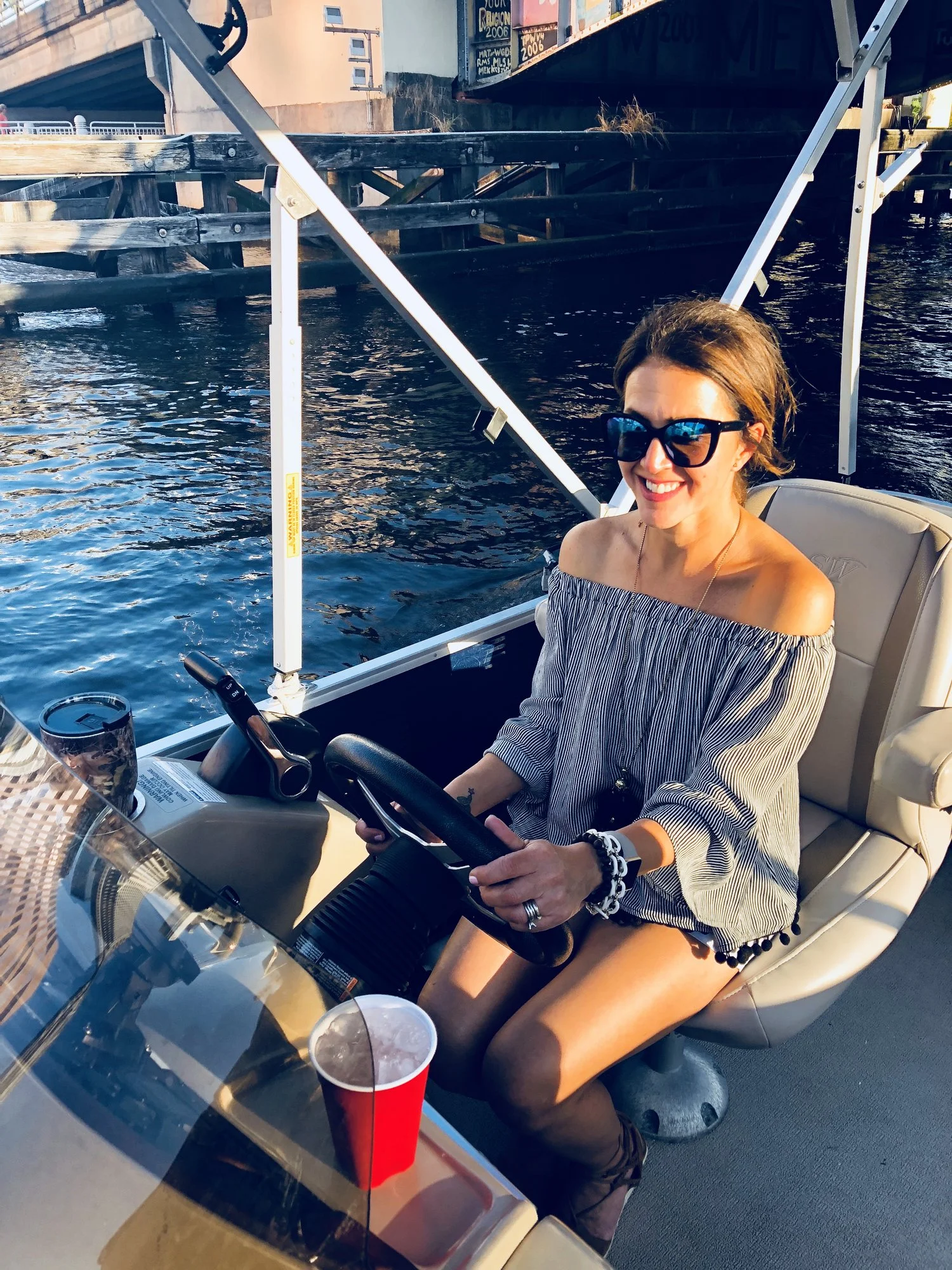 Playing Captain on my birthday cruise :) (top from Marshalls & white shorts (you can't see them) from Old Navy)