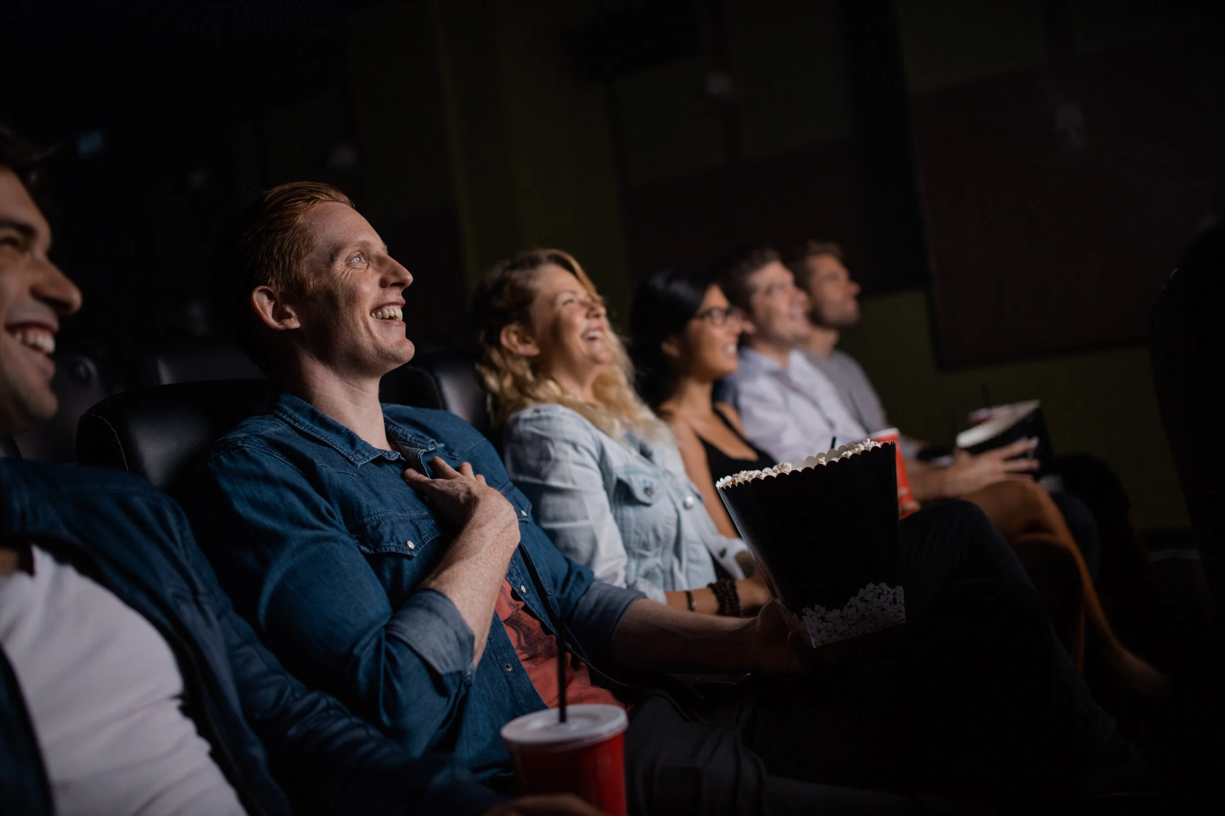 Young people watching movie in cinema.jpg