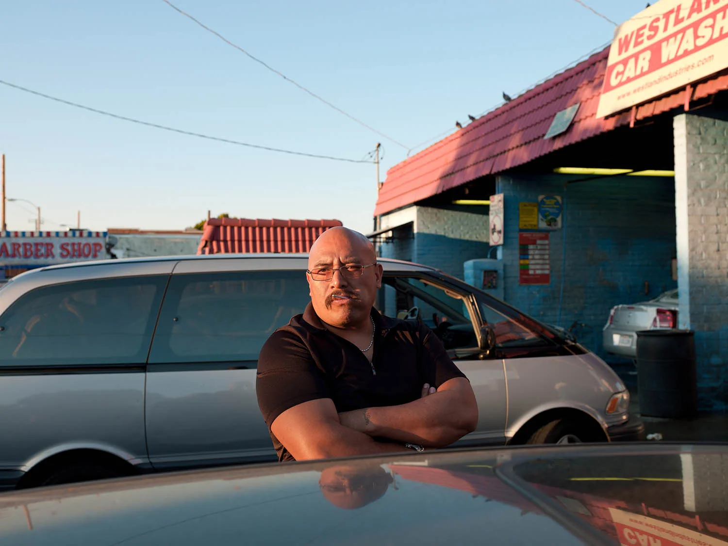 Efrain Marcos waiting to wash his car on Central Ave. and 42nd St. on March 3, 2012.