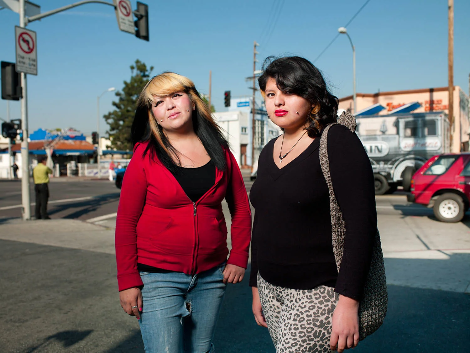 Sisters Banadia and Esbeldy Morales at the corner of Vernon and Central Avenues on March 20, 2012.