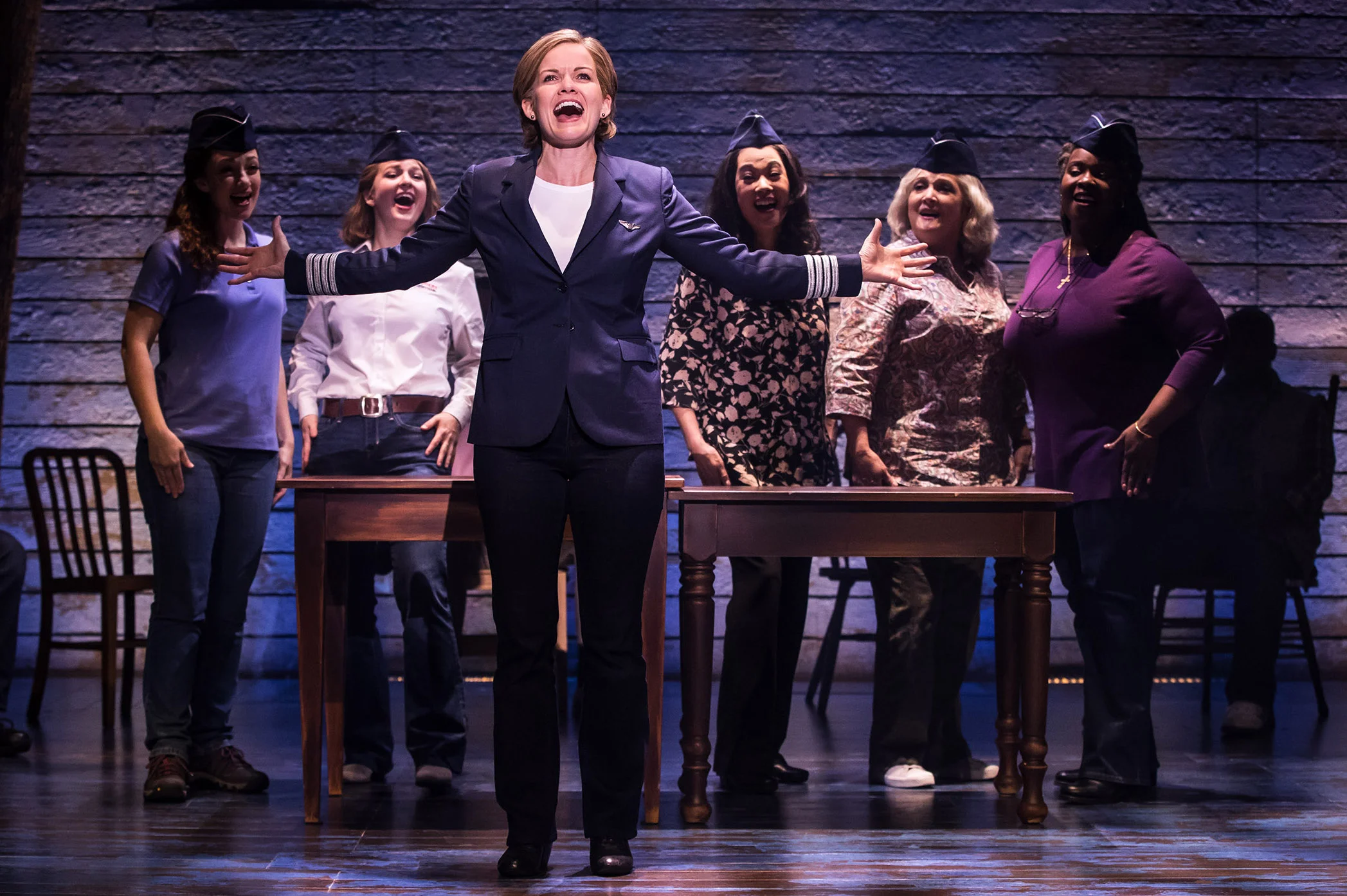 Becky Gulsvig (center) as pilot Beverley Bass in Come From Away.