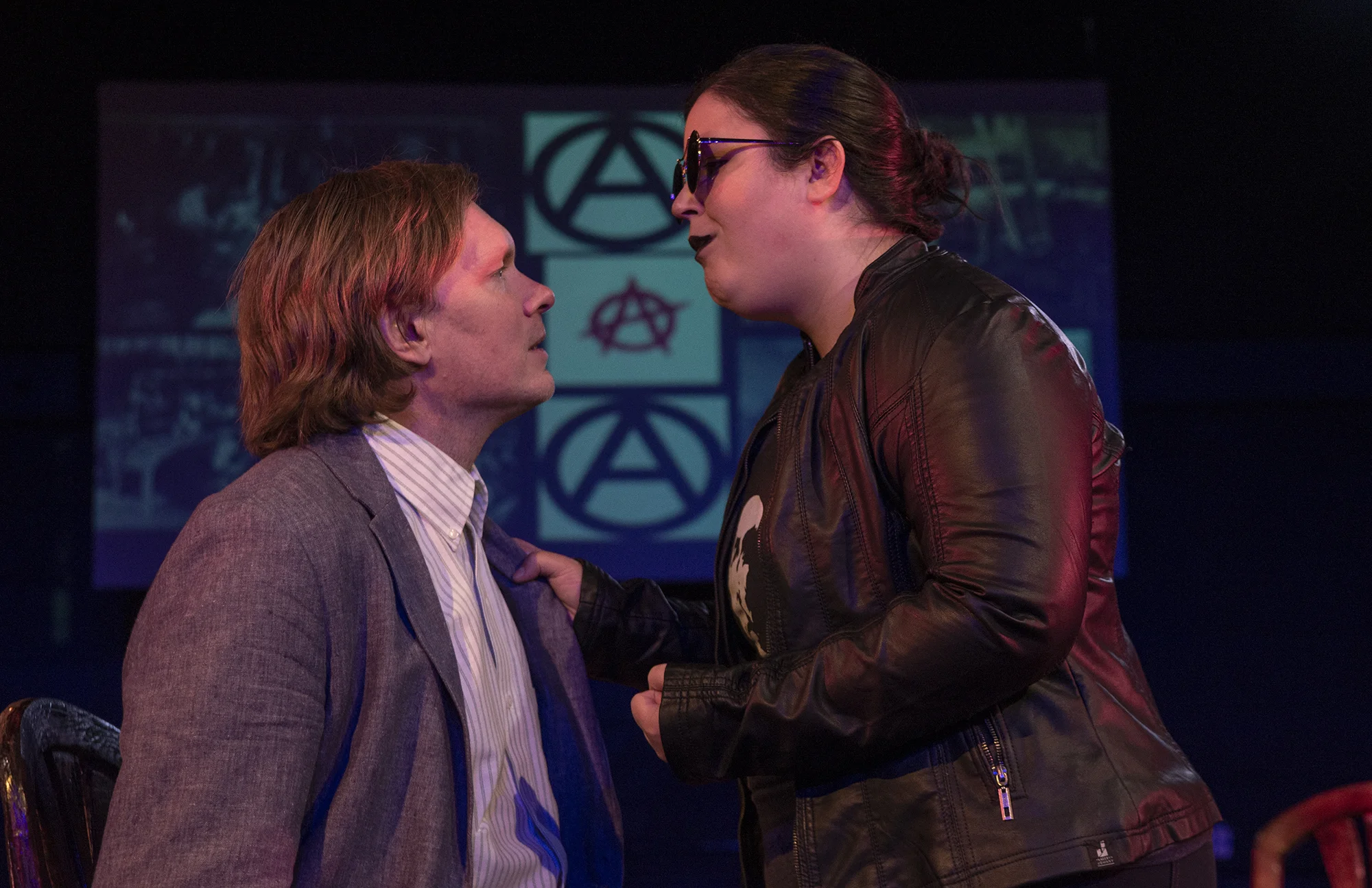 Leon Czolgosz (Jason Williams) talks with Emma Goldman (Katie Jones) in a scene from In the Assassins’ Garden.