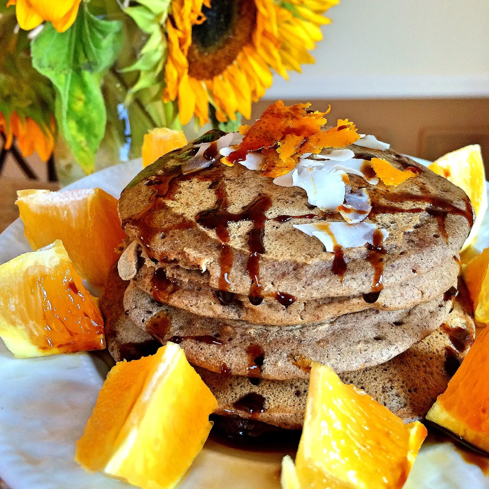 Throughout my childhood pancakes meant a lot of things. They meant my dad was home, they meant mornings filled with laughter and sugary kisses, and they released the weight of the week welcoming the relaxation of the weekend. Here is one of my favorites, Chocolate orange pancakes. The perfect fusion of sinfully rich dark chocolate and light citrus accents. These pancakes will be sure to satisfy, and provide the warmth and satisfaction of a weekend from childhood. 