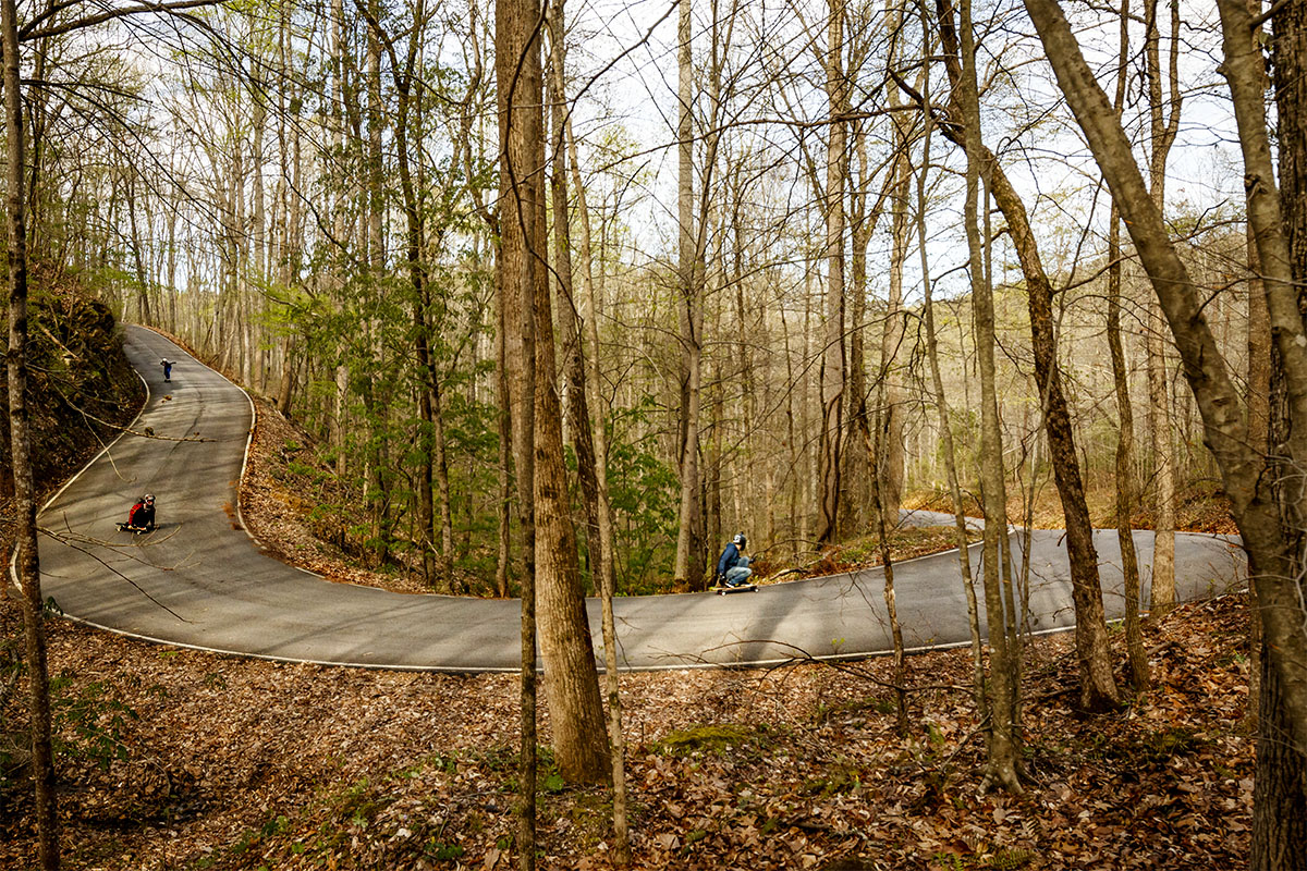 This corner is extremely strange. It's steep on the entrance, then flattens out and goes uphill and super off-camber at the exit. Madison Crum leading, then Dexter Manning and Garrett Gourley.