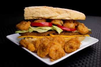 (Pictured) N’Awlins Po Boy Sandwich (Beef Hot Sausage & Shrimp) ($20.00) Additional .75 for cheese