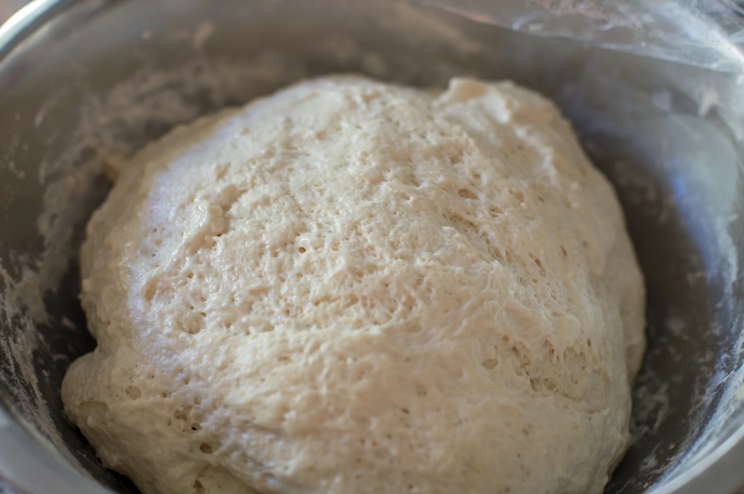 Left it to rest, then added half a cup of water with a tablespoon of salt. Folded four times, every 30 minutes for two and a half hours. *