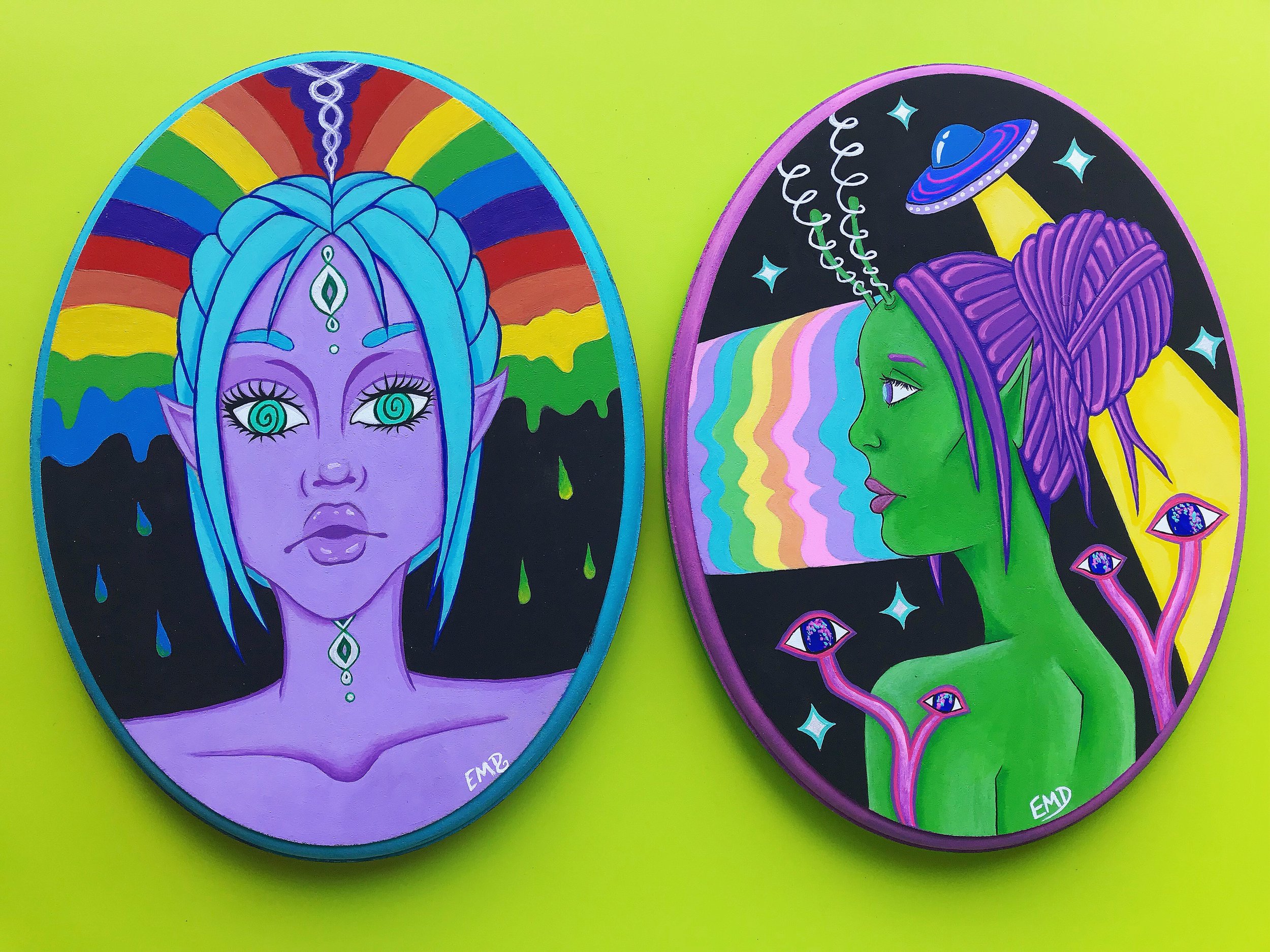 Galaxy sisters both painted on repurposed wood blocks from goodwill.