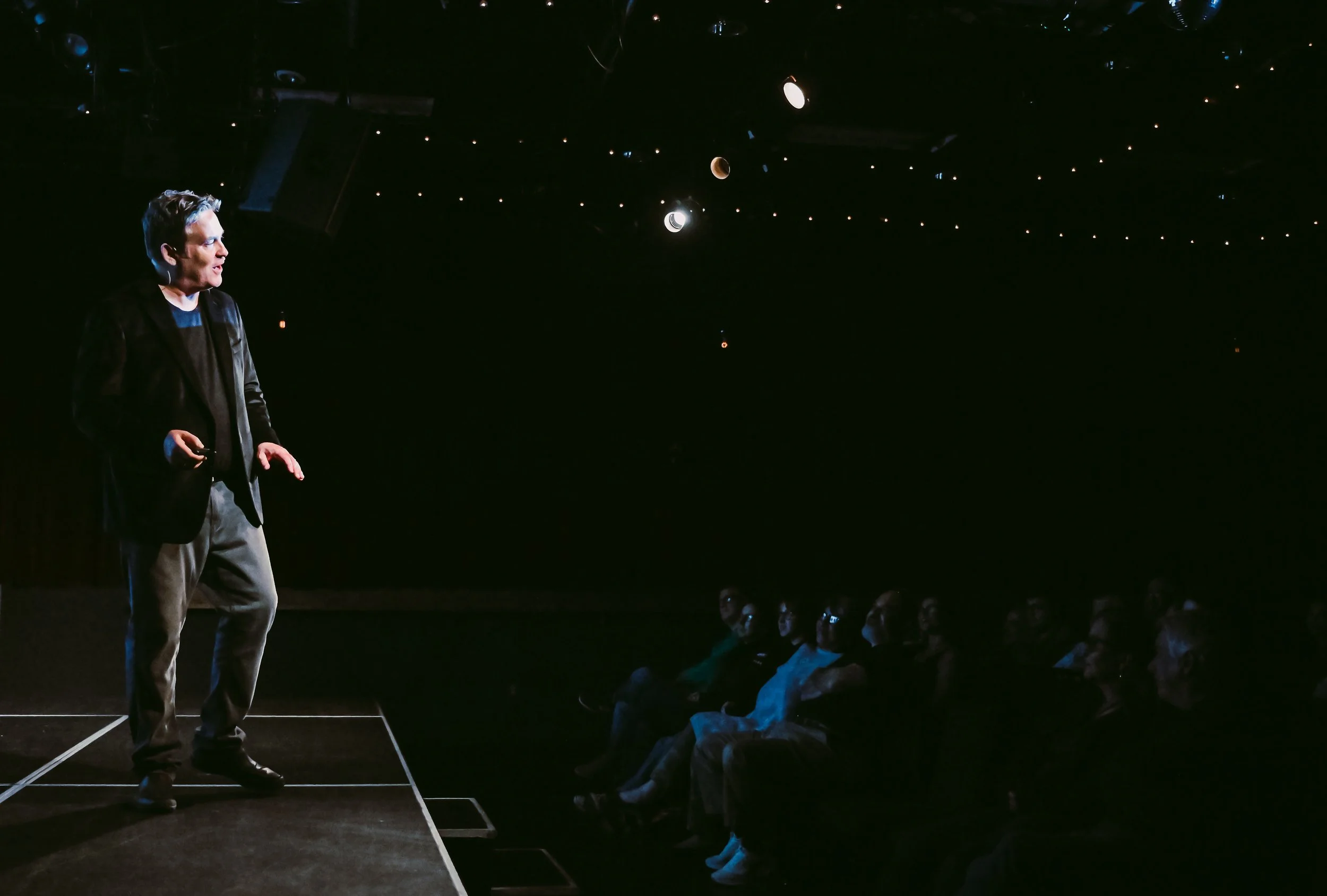 Michael M. Hughes on stage at the Creative Alliance in Baltimore, Maryland