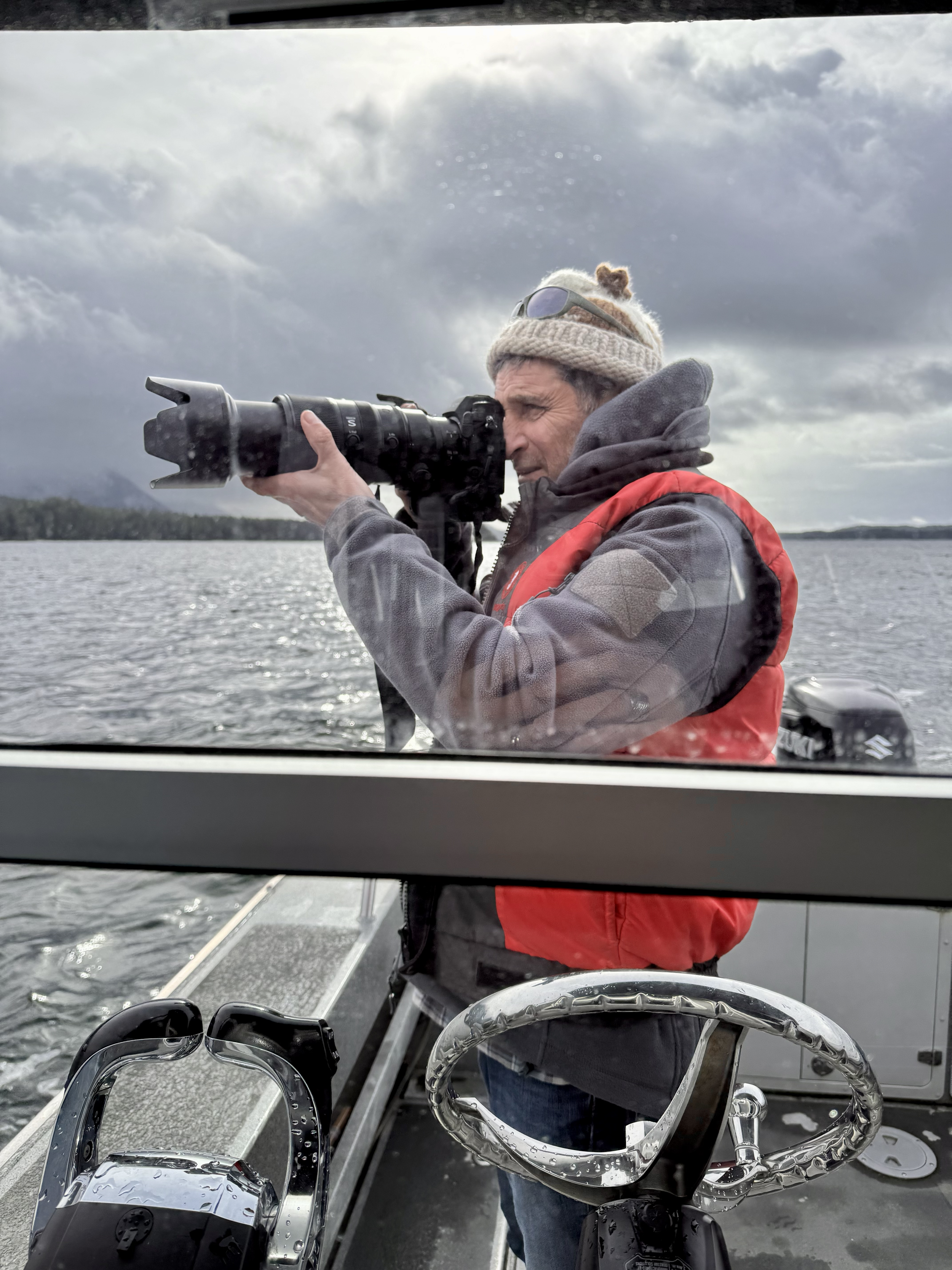 John Forde photographing whales on a whale watching tour in Tofino at The Whale Centre