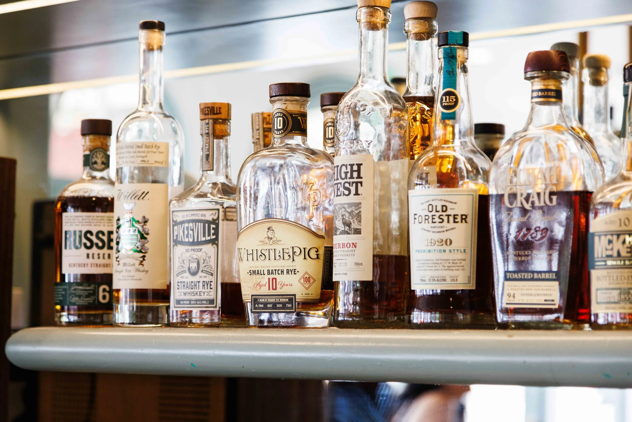  Commercial photo of a bar with expensive liquor and alcohol bottles. Shot for an editorial feature in the Los Angeles times by San Diego food photographer Amy Carson. 