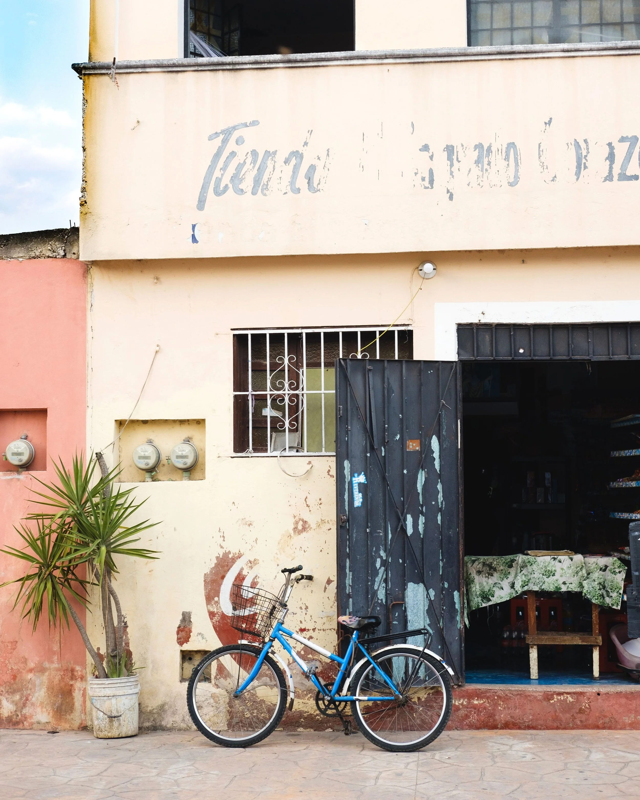  Commercial travel lifestyle photo of a shop with a bicycle in Yucatan, Mexico. Shot by San Diego based travel and lifestyle photographer Amy Carson. 