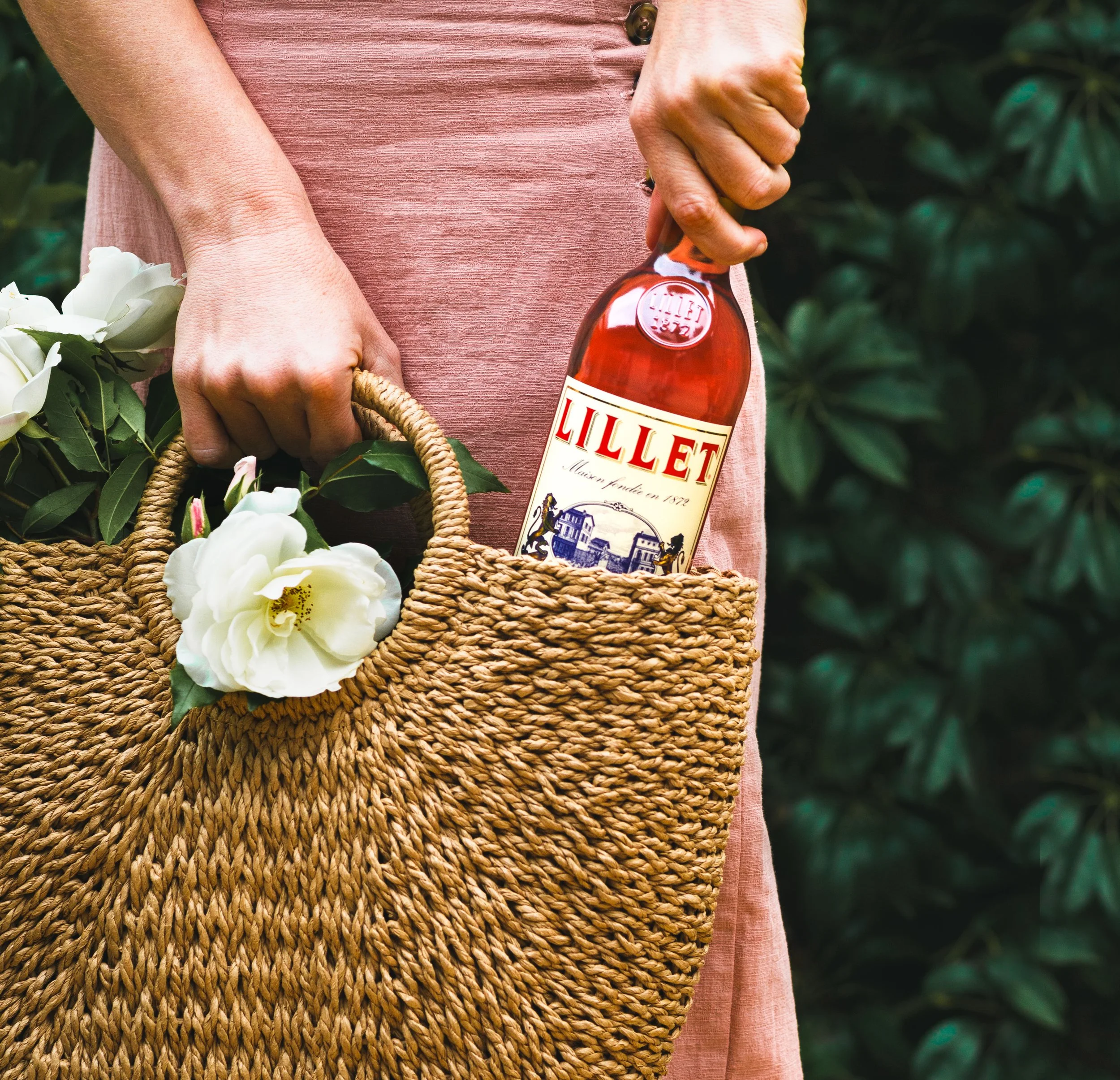  Advertising photo of a woman holding a bottle of Lillet wine. Shot by San Diego commercial food, beverage and lifestyle photographer Amy Carson. 