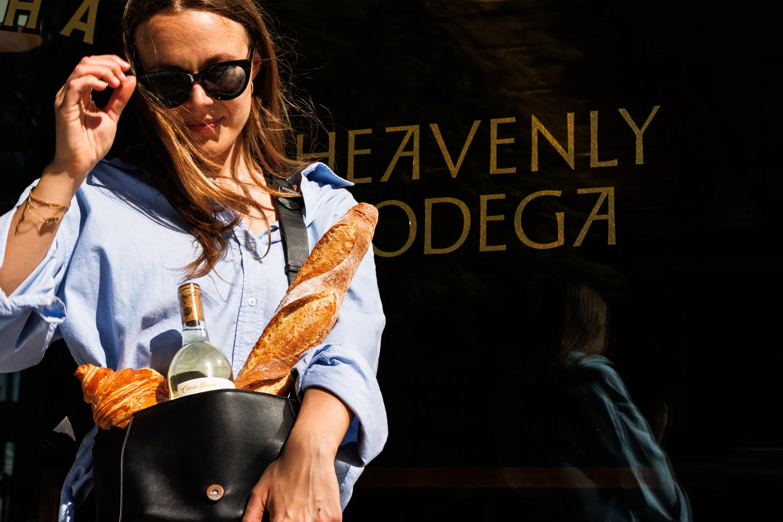 Commercial lifestyle portrait of a chic woman with wine. By Amy Carson.