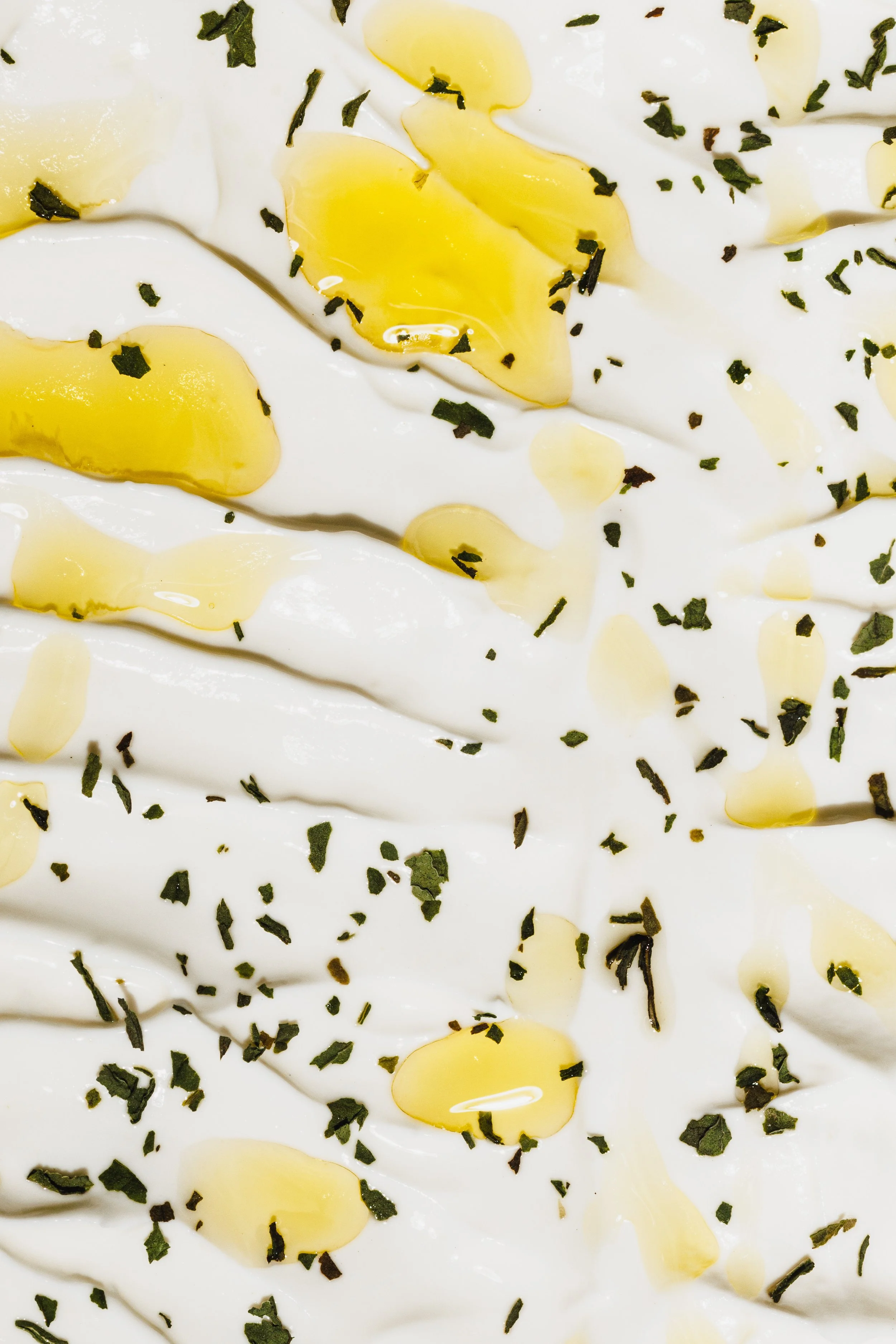 Commercial food macro of yogurt and olive oil for a San Diego restaurant. By Amy Carson.
