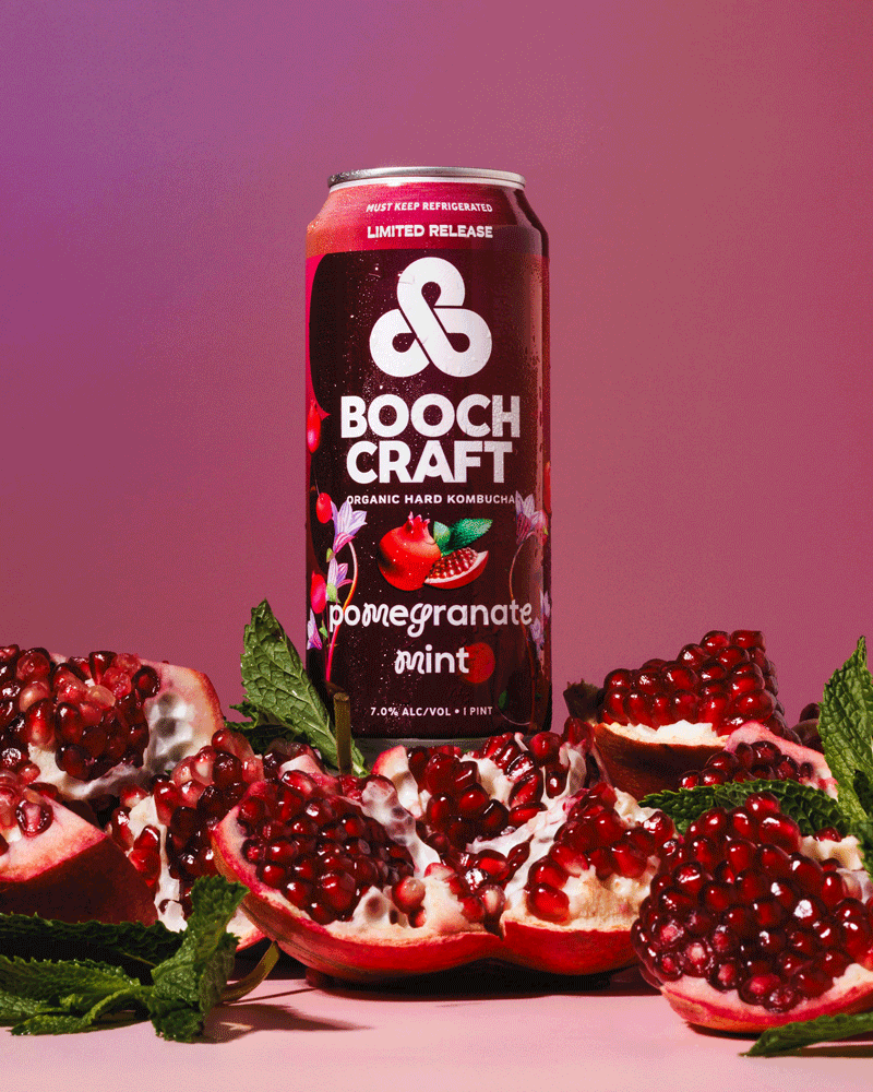 Commercial stop-motion GIF of a canned kombucha beverage spinning with pomegranates around. By San Diego lifestyle product photographer Amy Carson.