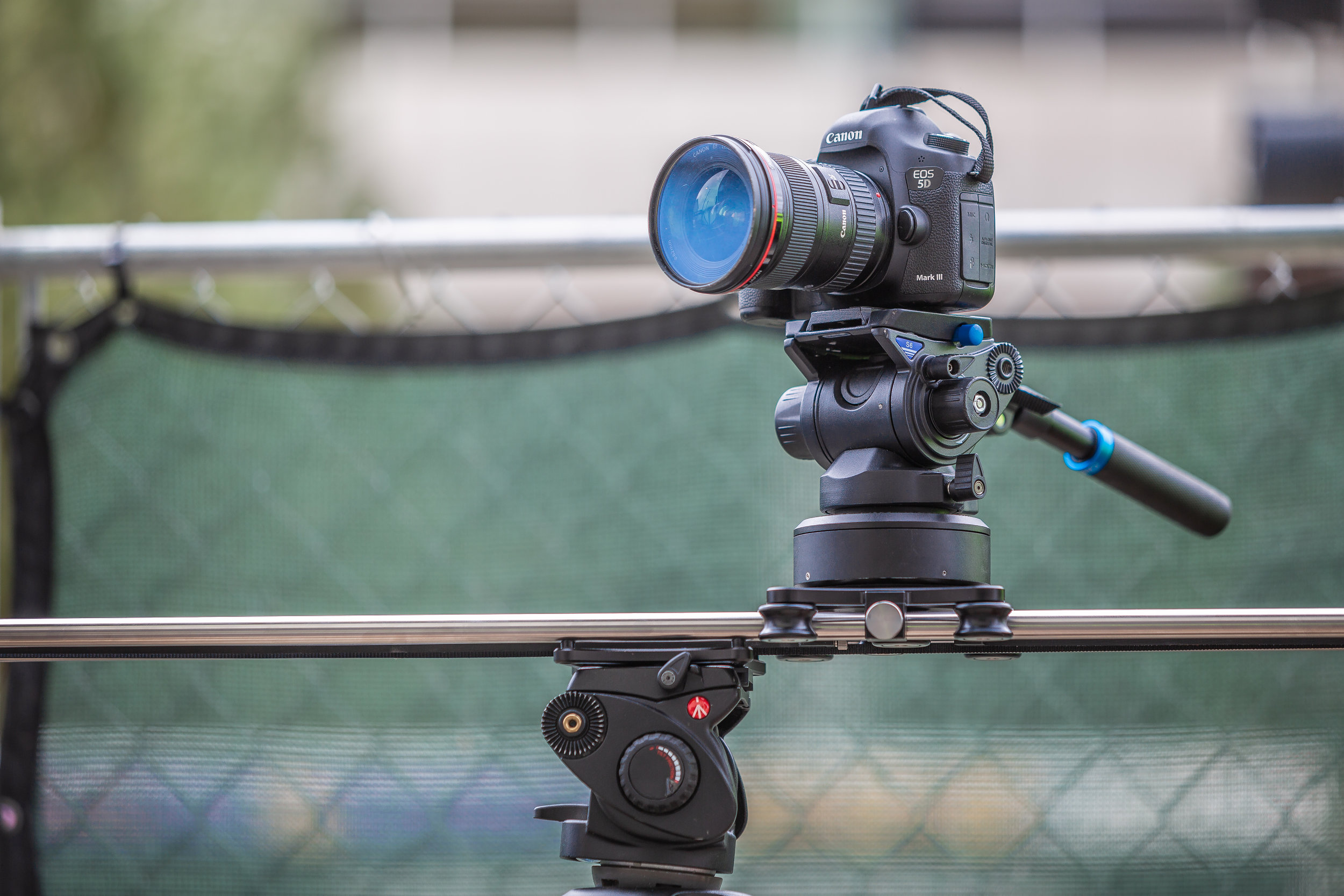 Behind the scenes photograph by Chicago photographer Rashad Anabtawi of a Canon 5D Mark III on a Rhino Slider shooting a time lapse of the event