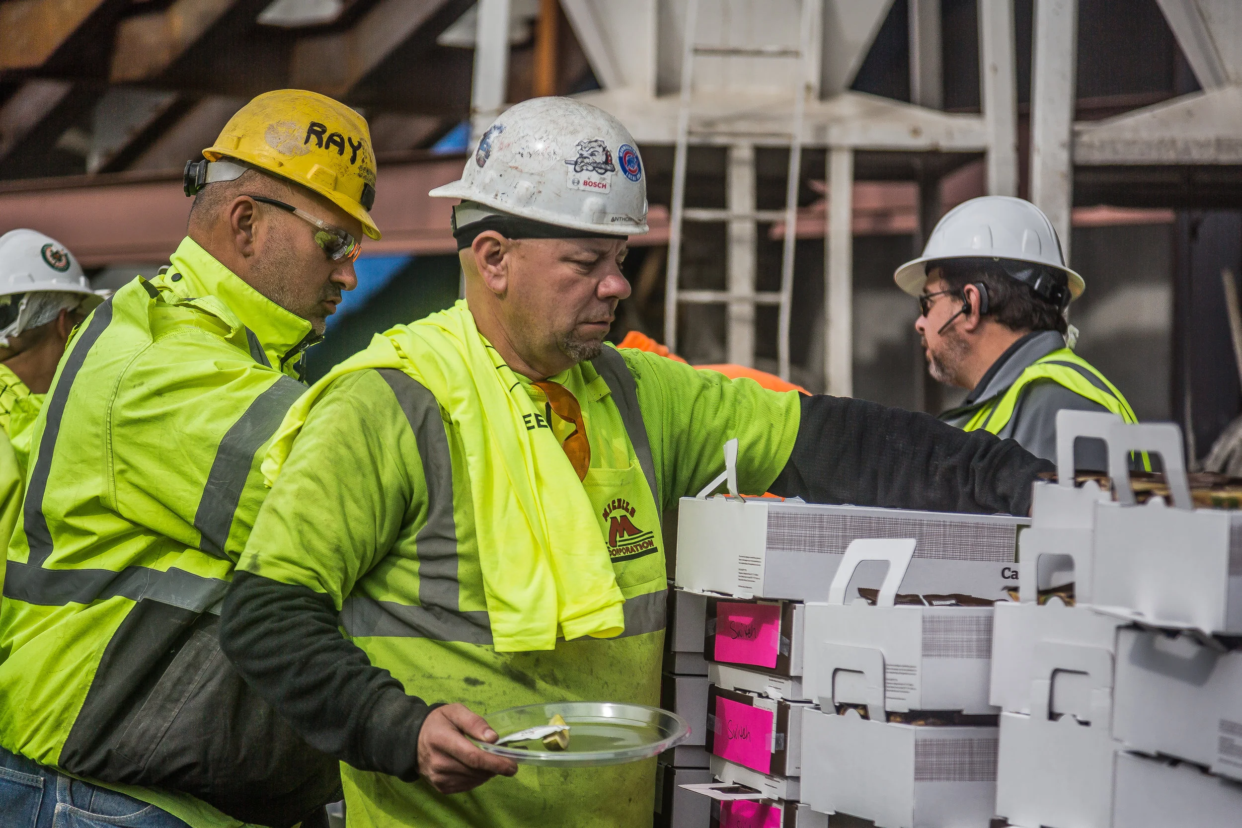 A candid Behind The Scenes Photograph of a Construction worker grabbing lunch shot by Chicago Set Photographer Rashad Anabtawi