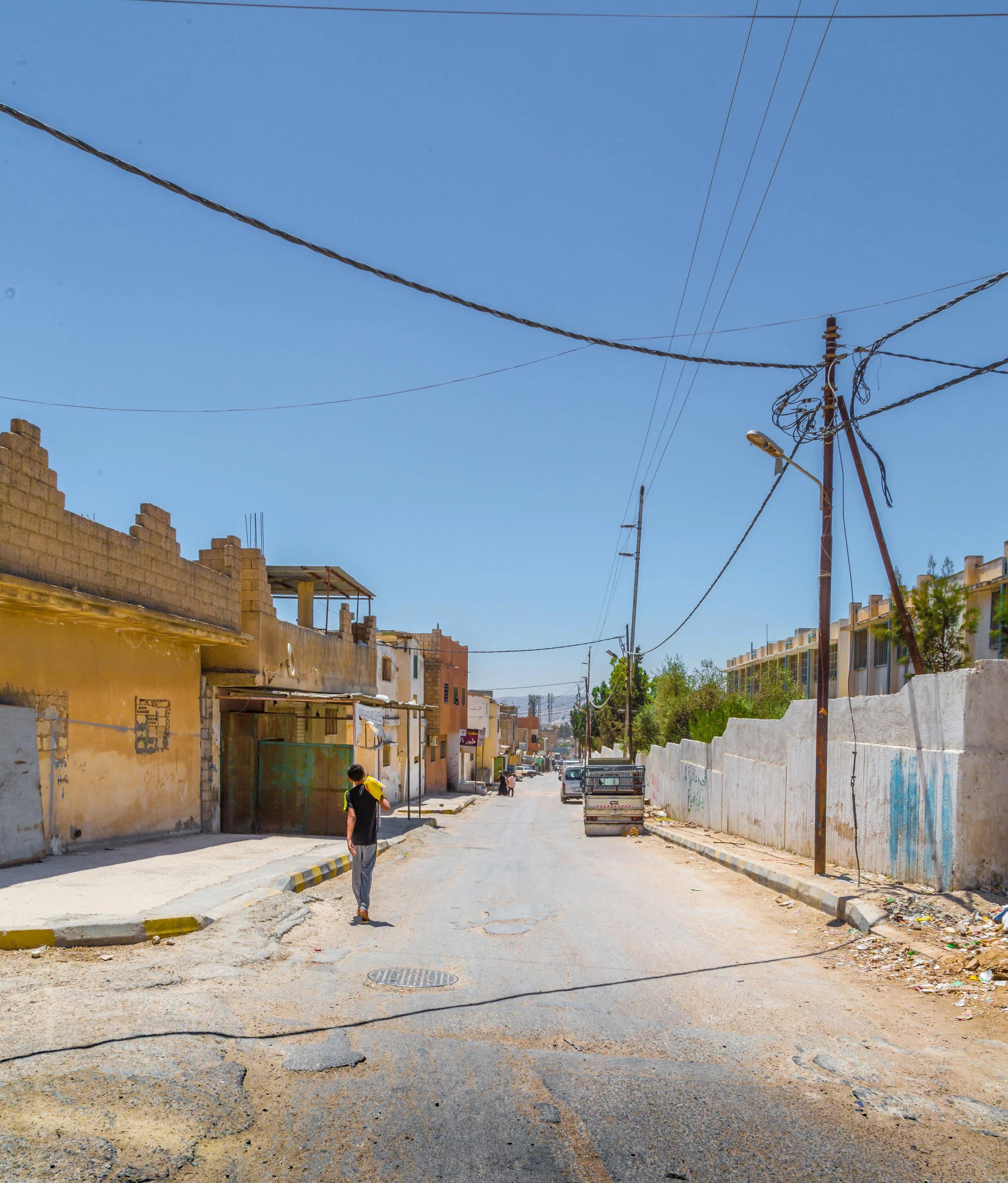 A Photograph of a young boy wlaking home in the Gaza Refugee camp in Jerash by photojournalist Rashad S Anabtawi