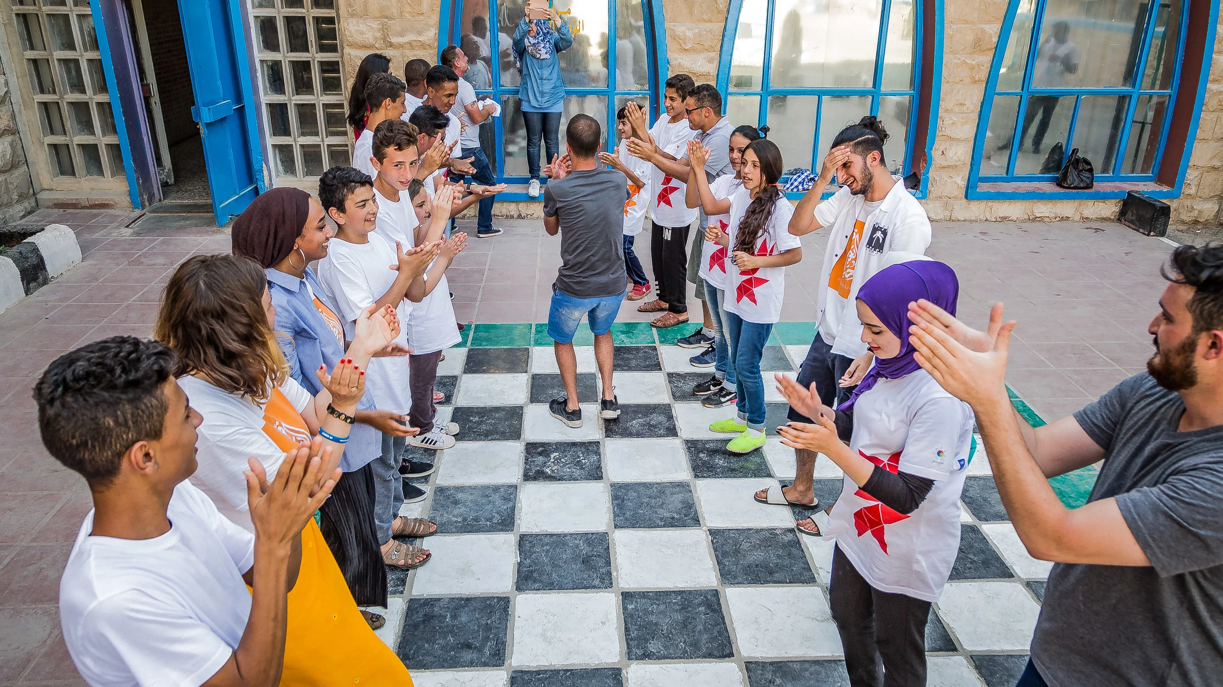 A  Photograph by Rashad Anabtawi of everyone celebrating
